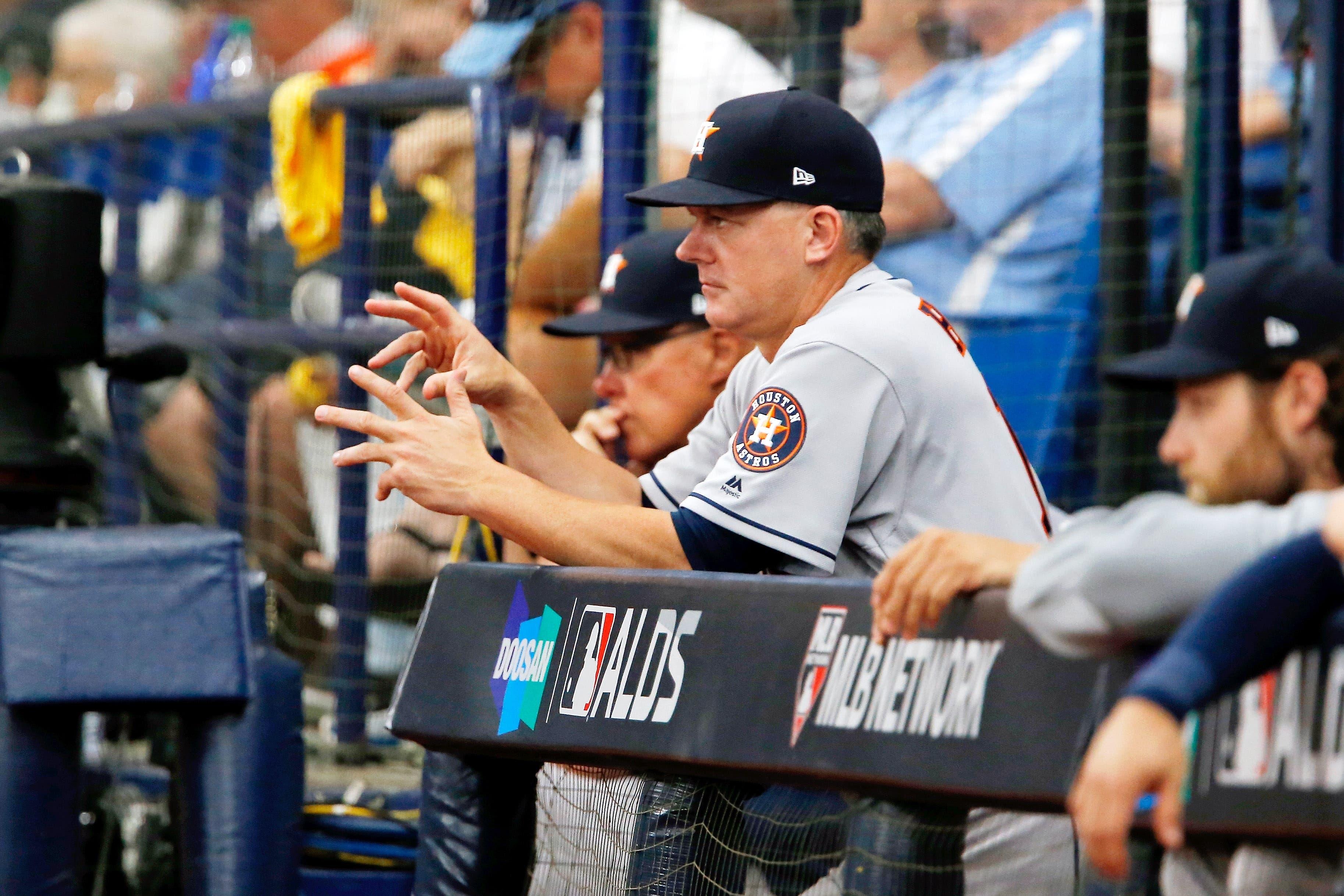 Oct 7, 2019; St. Petersburg, FL, USA; Houston Astros manager AJ Hinch (14) gestures while in the dugout during the seventh inning against the Tampa Bay Rays in game three of the 2019 ALDS playoff baseball series at Tropicana Field. Mandatory Credit: Reinhold Matay-USA TODAY Sports / Reinhold Matay