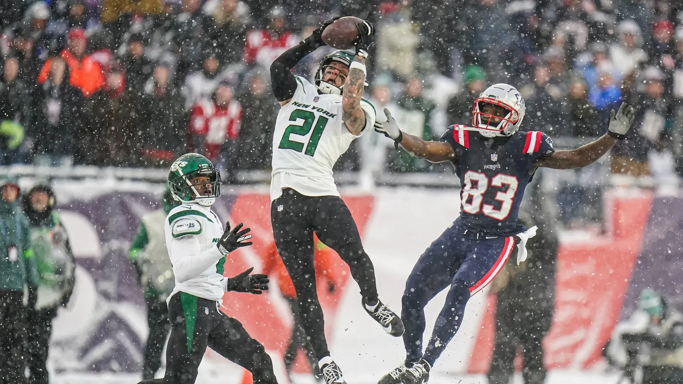 Jan 7, 2024; Foxborough, Massachusetts, USA; New York Jets safety Ashtyn Davis (21) intercepts a pass intended for New England Patriots wide receiver Jalen Reagor (83) in the second half at Gillette Stadium. / David Butler II-USA TODAY Sports