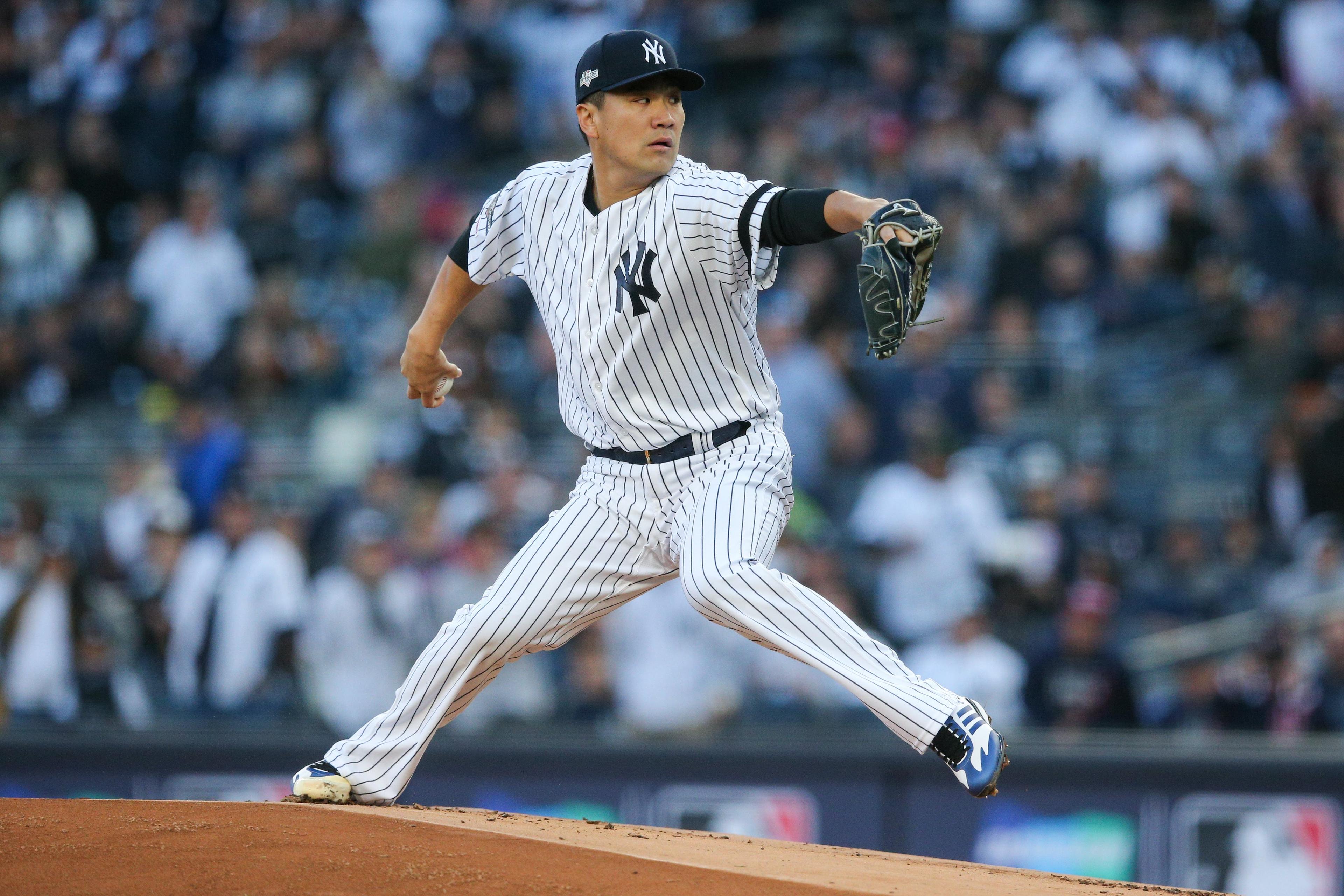 Oct 5, 2019; Bronx, NY, USA; New York Yankees starting pitcher Masahiro Tanaka (19) throws against the Minnesota Twins in the first inning in game two of the 2019 ALDS playoff baseball series at Yankee Stadium. Mandatory Credit: Brad Penner-USA TODAY Sports / Brad Penner