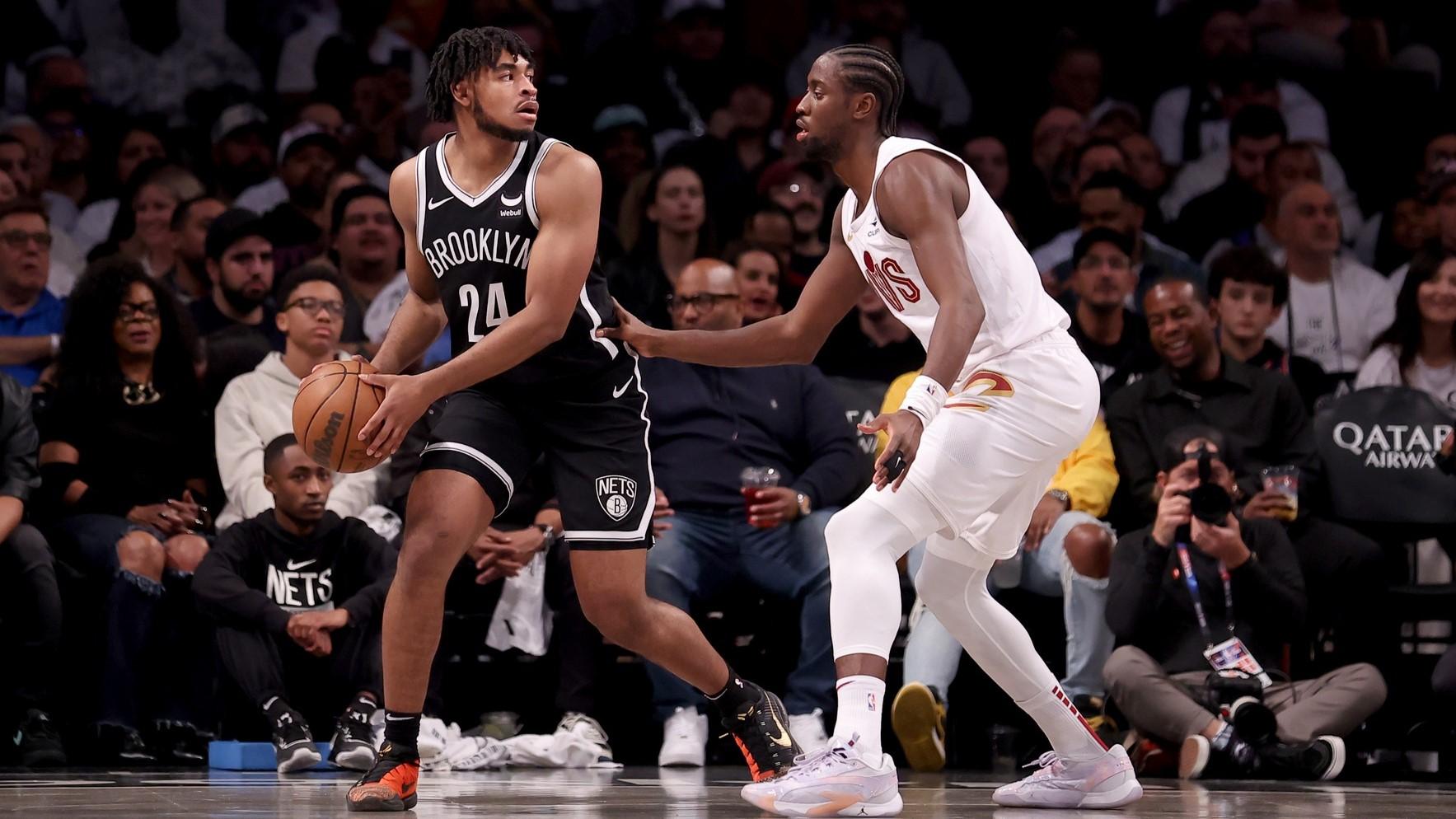 Oct 25, 2023; Brooklyn, New York, USA; Brooklyn Nets guard Cam Thomas (24) controls the ball against Cleveland Cavaliers guard Caris LeVert (3) during the second quarter at Barclays Center. / Brad Penner-USA TODAY Sports