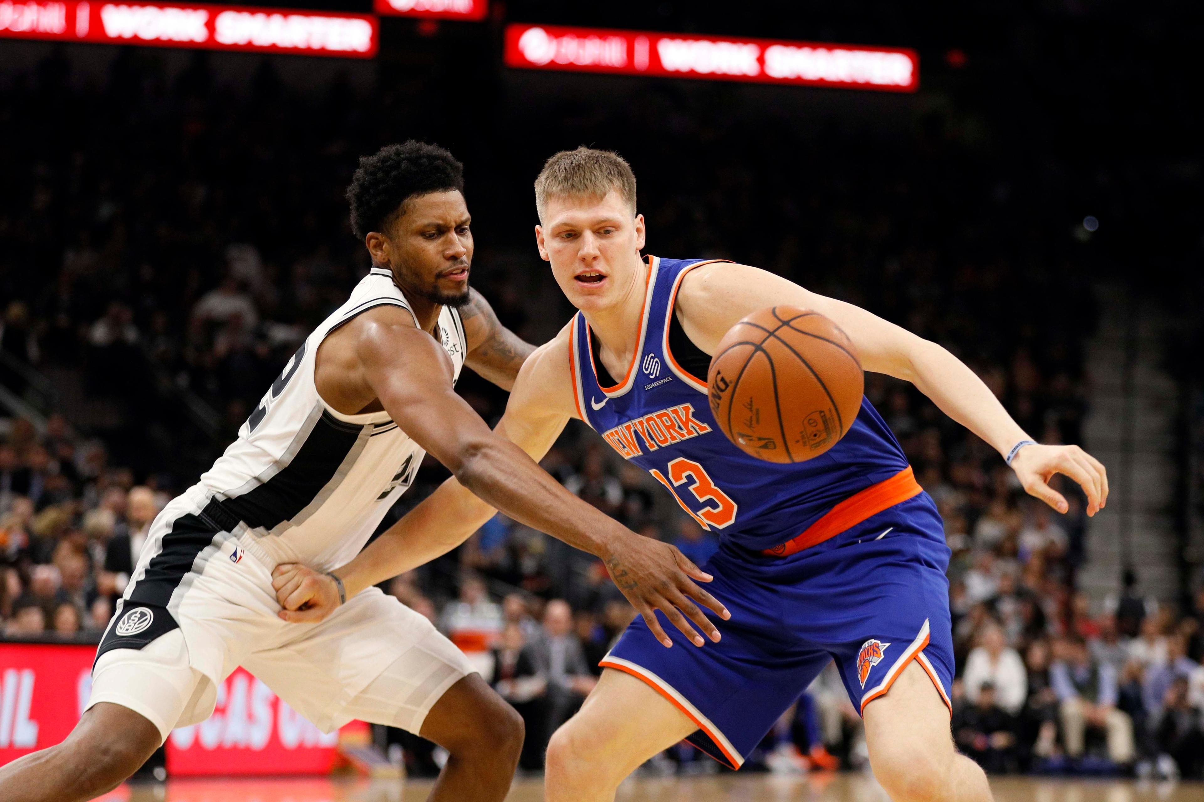 Mar 15, 2019; San Antonio, TX, USA; San Antonio Spurs small forward Rudy Gay (22) reaches in to steal the ball from New York Knicks power forward Henry Ellenson (right) during the second half at AT&T Center. Mandatory Credit: Soobum Im-USA TODAY Sports