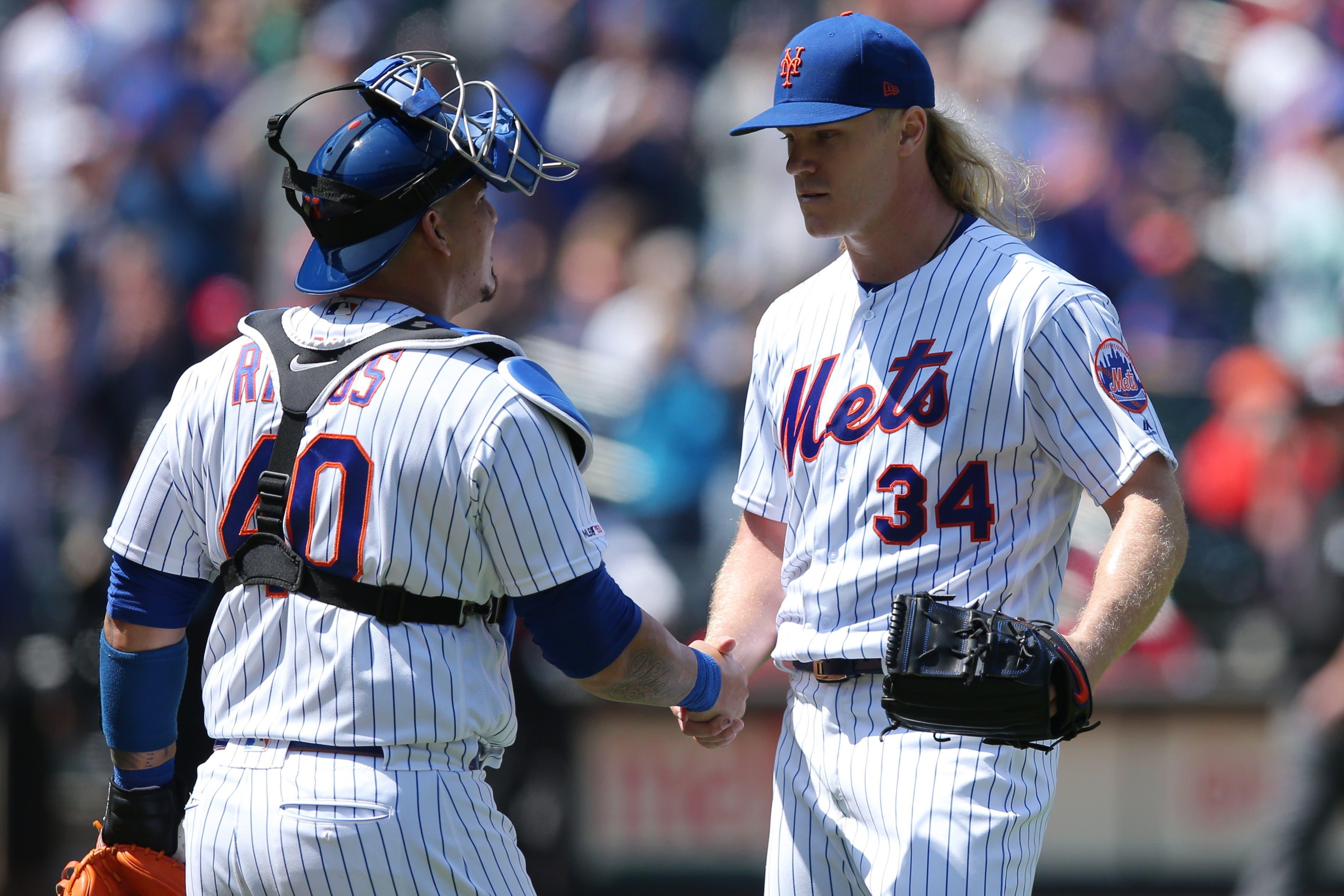 May 2, 2019; New York City, NY, USA; New York Mets starting pitcher Noah Syndergaard (34) shakes hands with catcher Wilson Ramos (40) after throwing a complete game shutout against the Cincinnati Reds at Citi Field. Syndergaard allowed four hits and a walk while striking out ten. Mandatory Credit: Brad Penner-USA TODAY Sports / Brad Penner