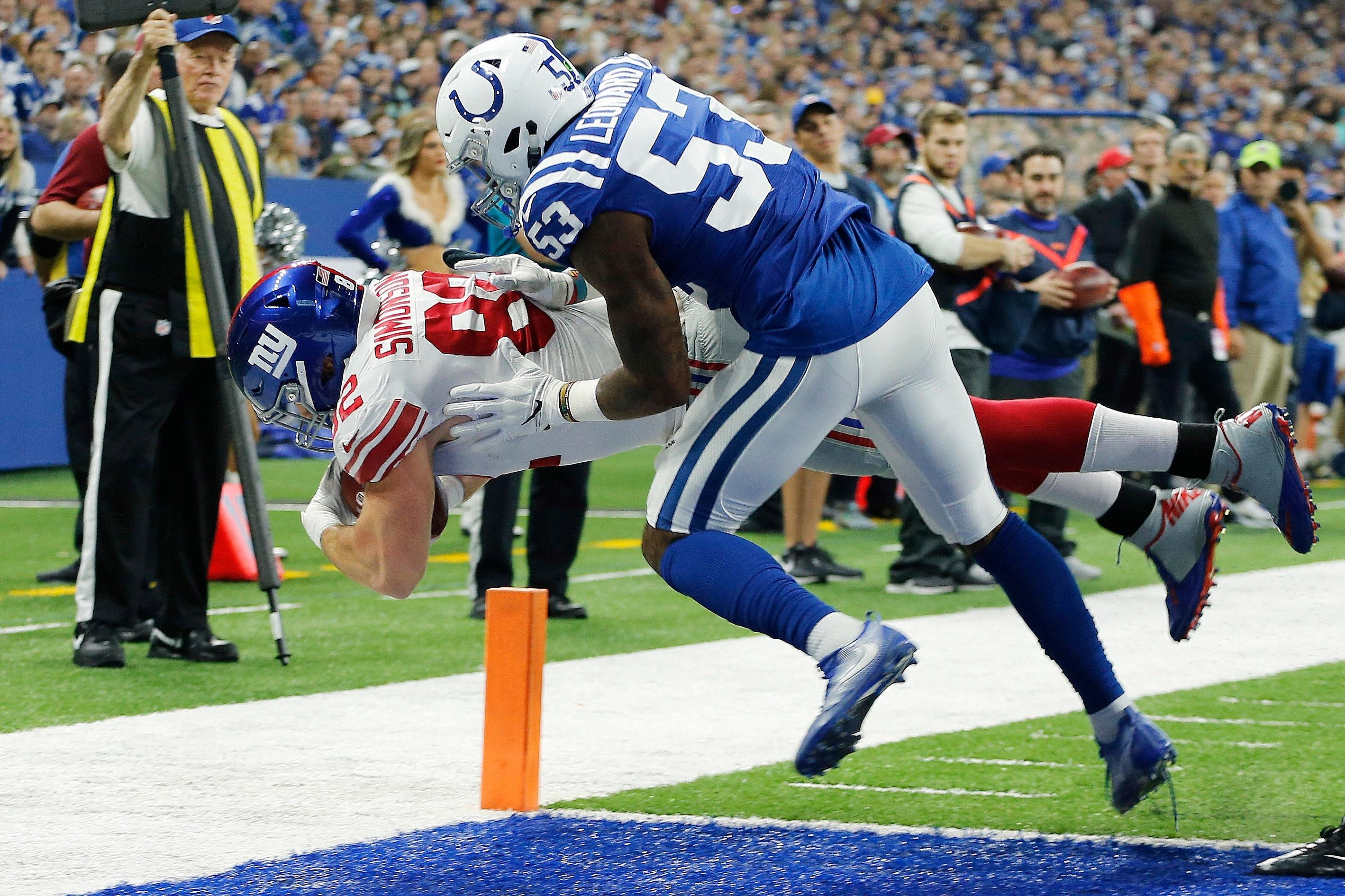 Dec 23, 2018; Indianapolis, IN, USA; New York Giants tight end Scott Simonson (82) scores a touchdown past Indianapolis Colts linebacker Darius Leonard (53) at Lucas Oil Stadium. Mandatory Credit: Brian Spurlock-USA TODAY Sports 