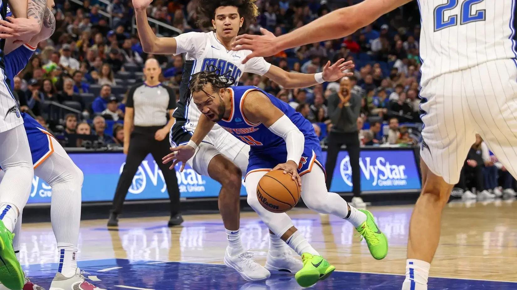 Dec 29, 2023; Orlando, Florida, USA; New York Knicks guard Jalen Brunson (11) is fouled by Orlando Magic guard Anthony Black (0) during the second quarter at KIA Center. / Mike Watters-USA TODAY Sports