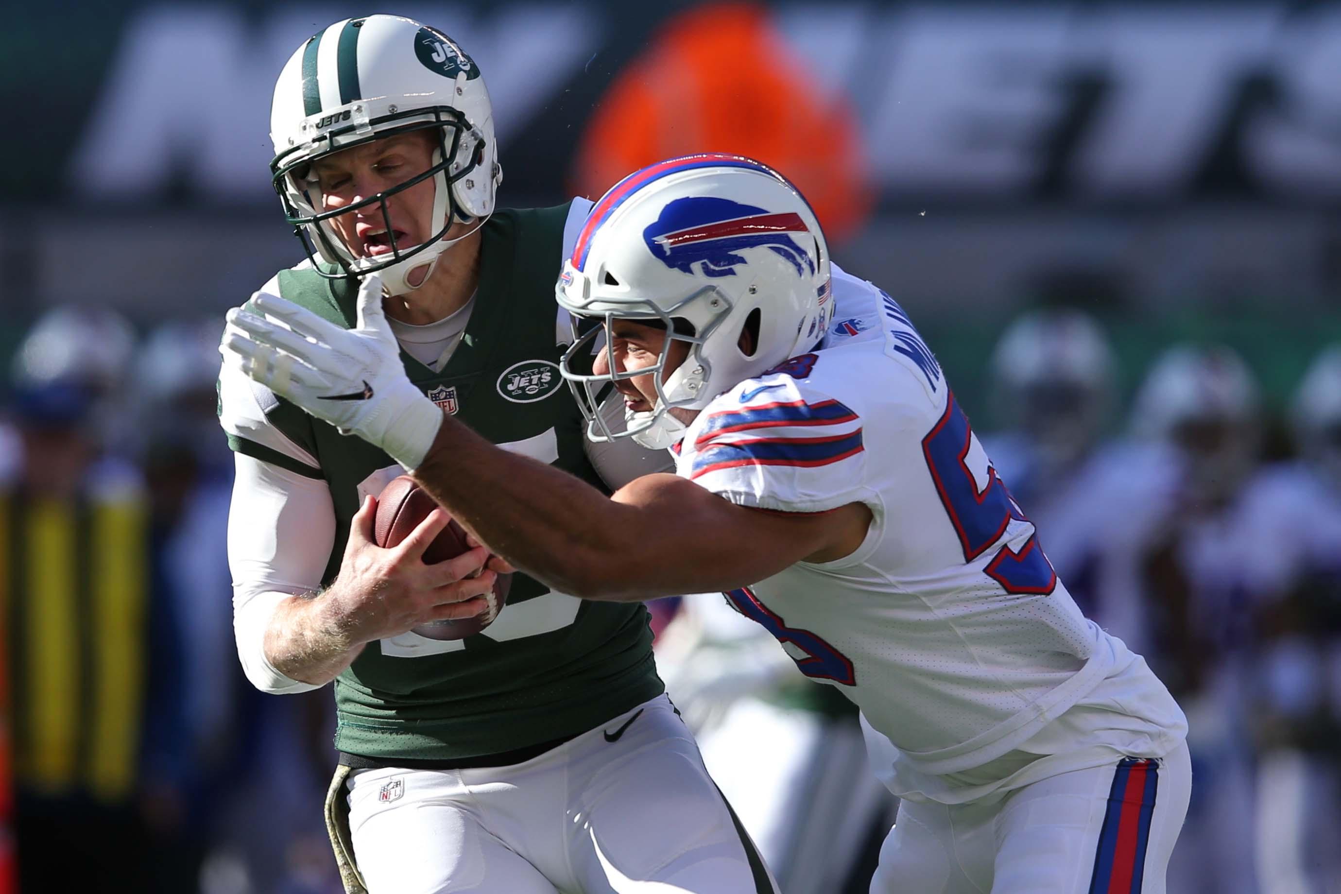 Nov 11, 2018; East Rutherford, NJ, USA; New York Jets quarterback Josh McCown (15) is sacked by Buffalo Bills defensive end Jerry Hughes (55) during the first quarter at MetLife Stadium. Mandatory Credit: Brad Penner-USA TODAY Sports