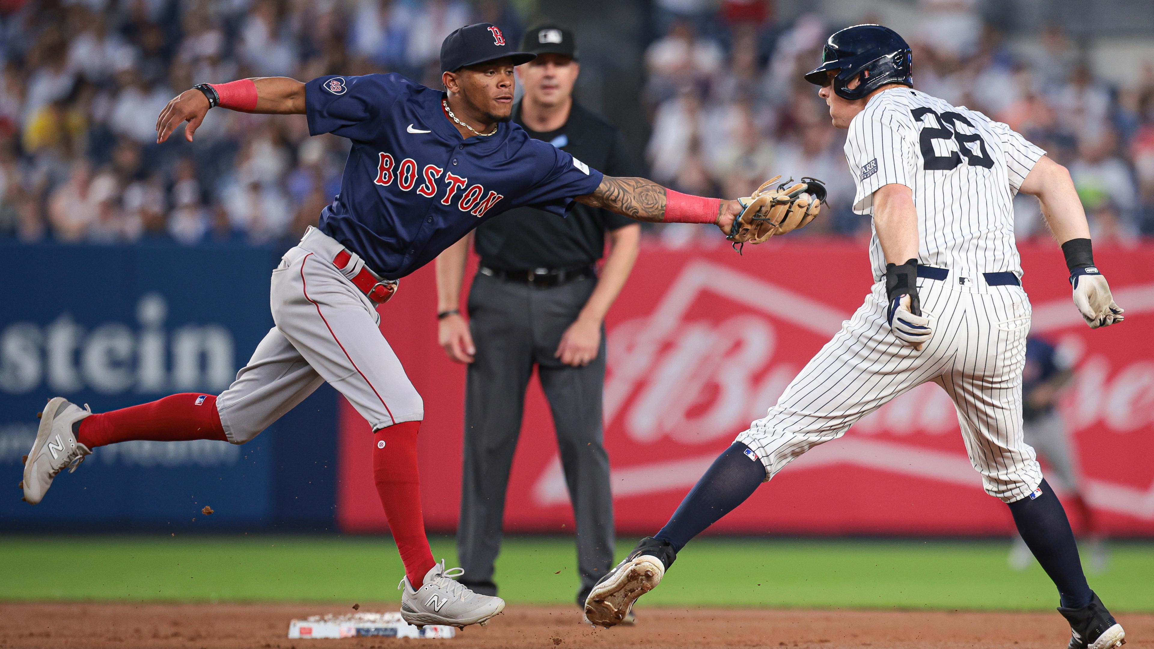 Boston Red Sox center fielder Ceddanne Rafaela (43) attempts to tag New York Yankees third baseman DJ LeMahieu (26) at second base during the third inning at Yankee Stadium. 