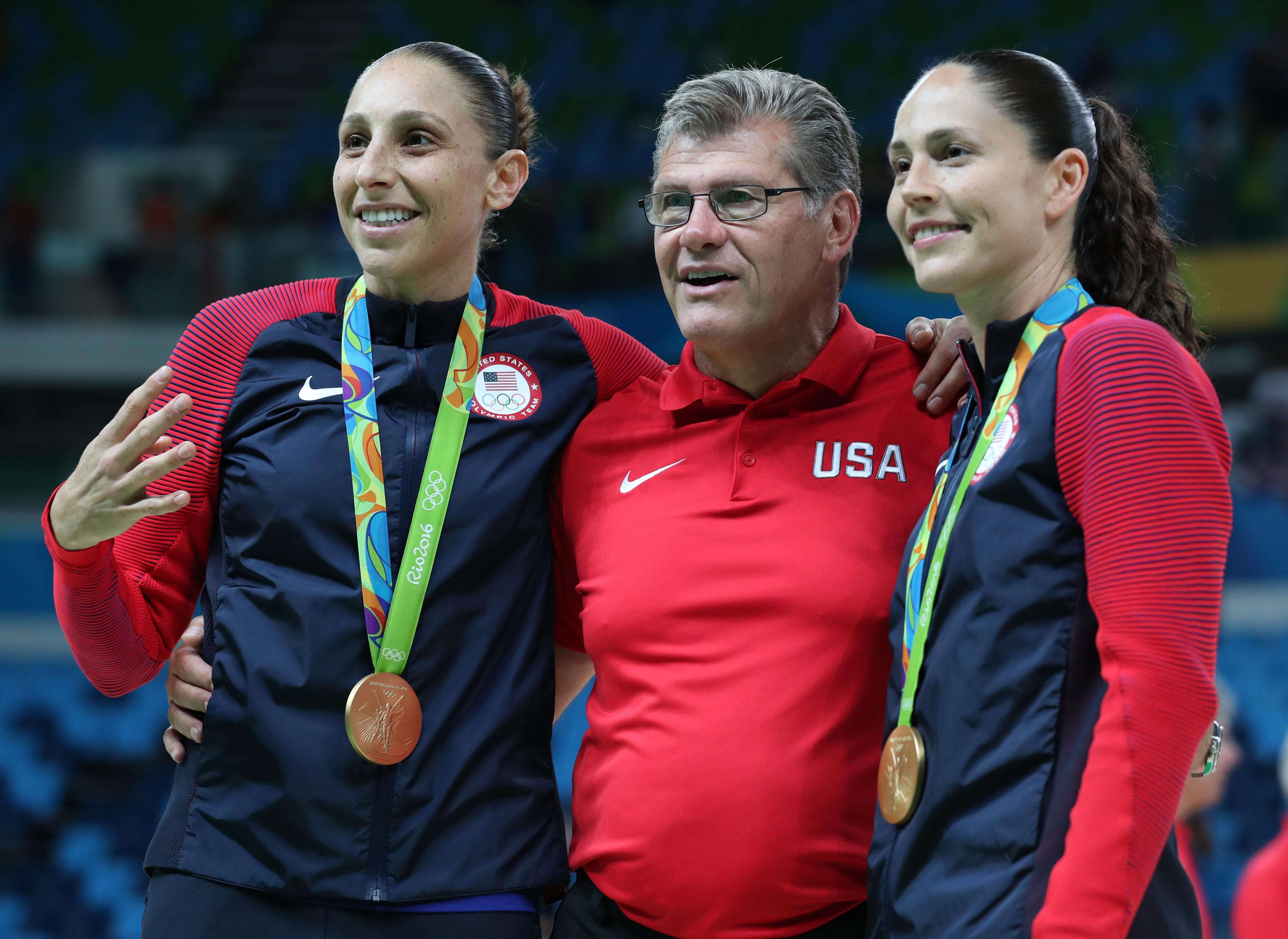 Diana Taurasi, left, and Sue Bird, right, pose for a picture with Team USA and UConn coach Geno Auriemma after the victory over Spain the gold medal game Saturday. (Jeff Swinger-USA TODAY Sports)