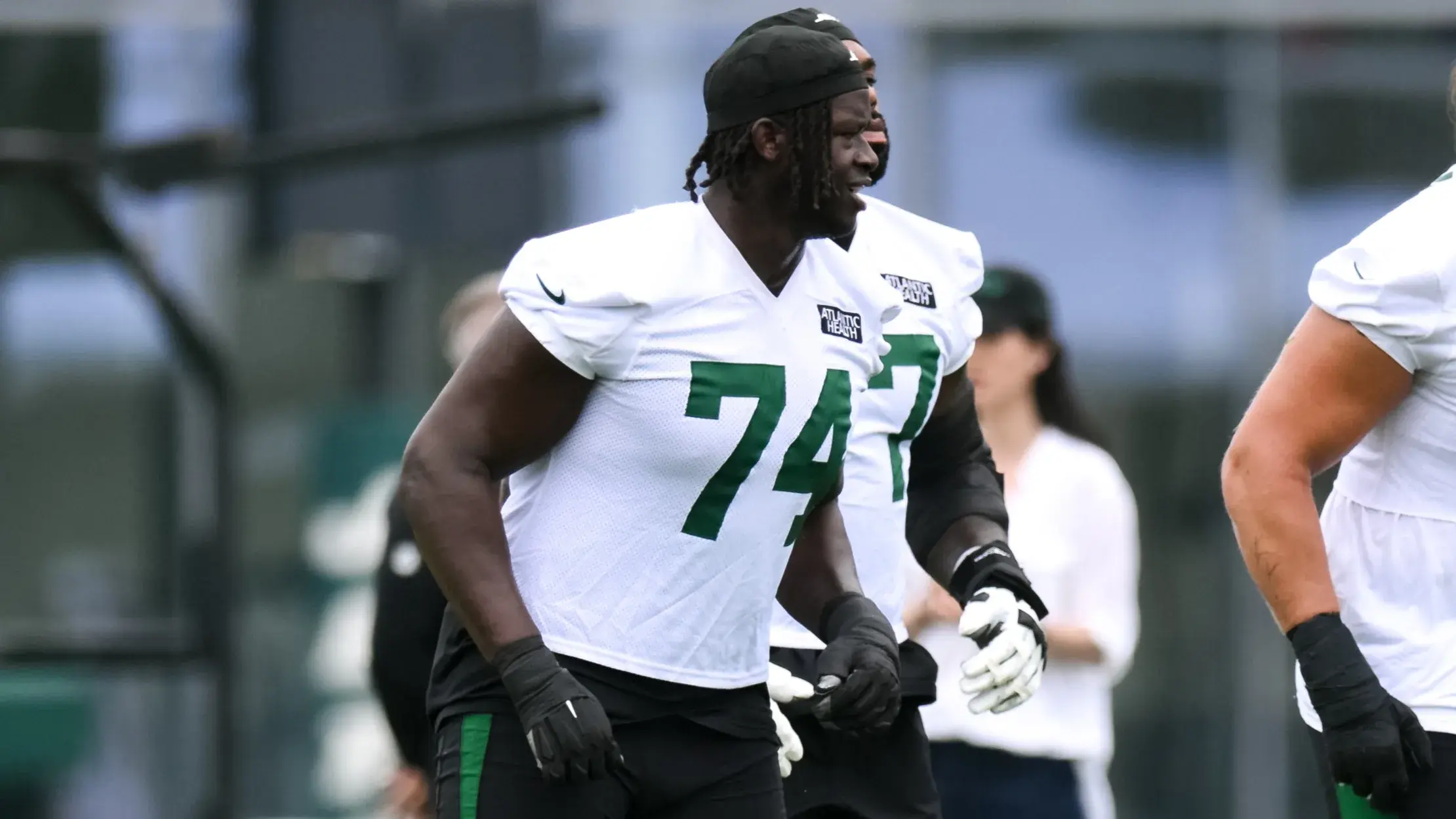 Jul 25, 2024; Florham Park, NJ, USA; New York Jets offensive tackle Olu Fashanu (74) warms up during training camp at Atlantic Health Jets Training Center. Mandatory Credit: John Jones-USA TODAY Sports / © John Jones-USA TODAY Sports