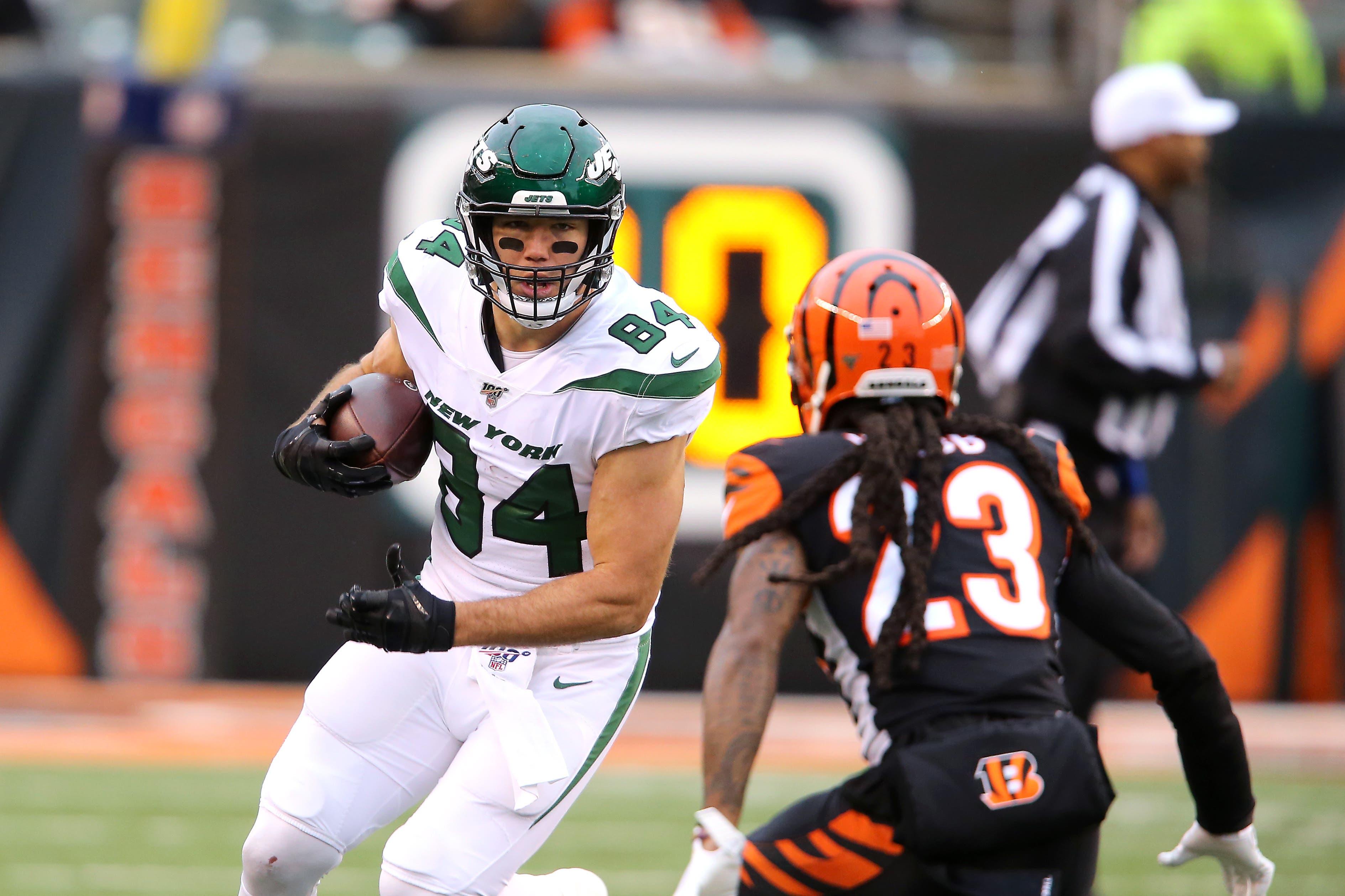 Dec 1, 2019; Cincinnati, OH, USA; New York Jets tight end Ryan Griffin (84) runs after catch as Cincinnati Bengals cornerback B.W. Webb (23) defends during the second quarter at Paul Brown Stadium. Mandatory Credit: Joe Maiorana-USA TODAY Sports / Joseph Maiorana