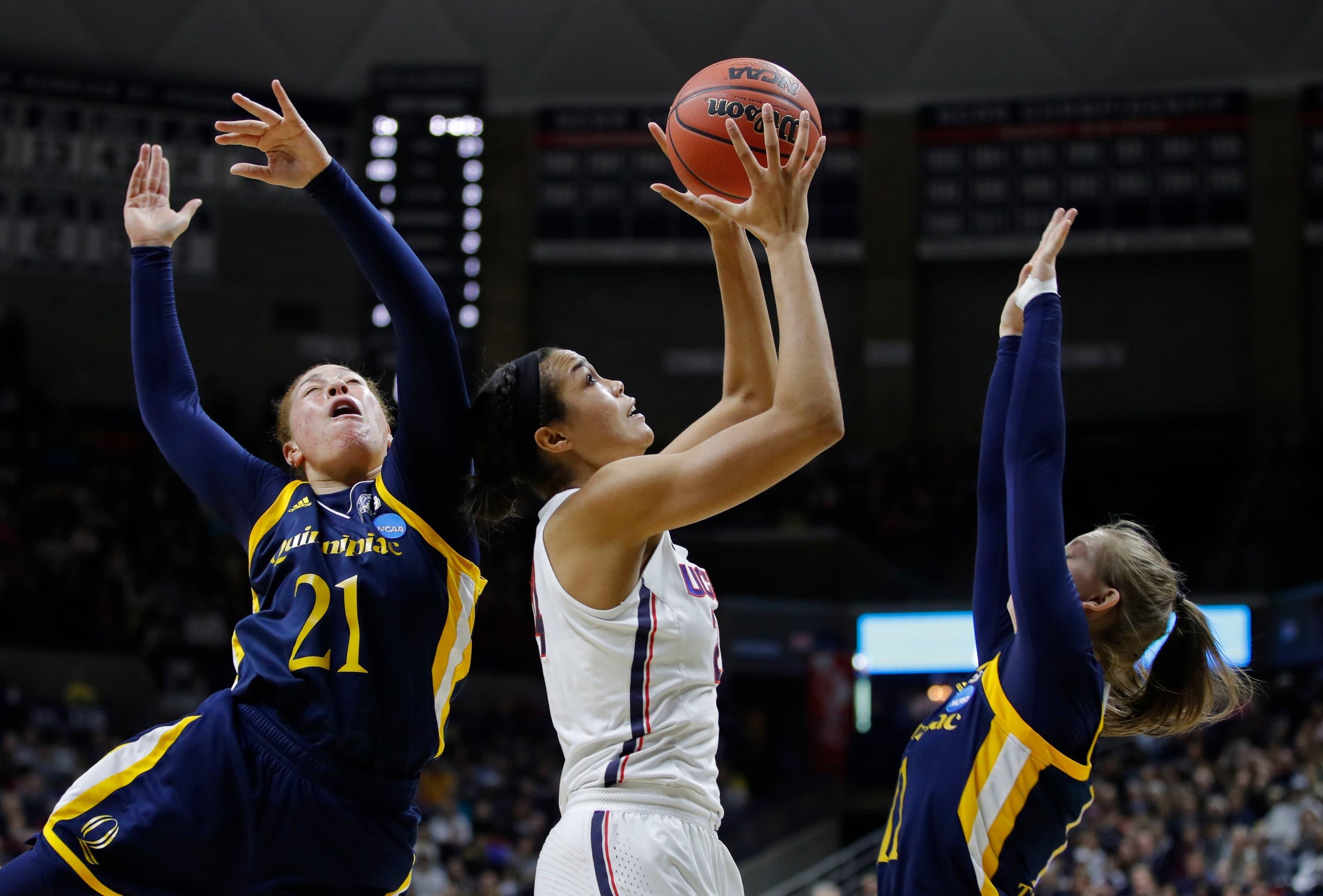 Connecticut Huskies forward Napheesa Collier attempts to control the ball as Quinnipiac Bobcats forward Jen Fay and guard Edel Thornton defend in the first half of the women's NCAA tournament second round at Gampel Pavilion. / David Butler II/USA TODAY Sports