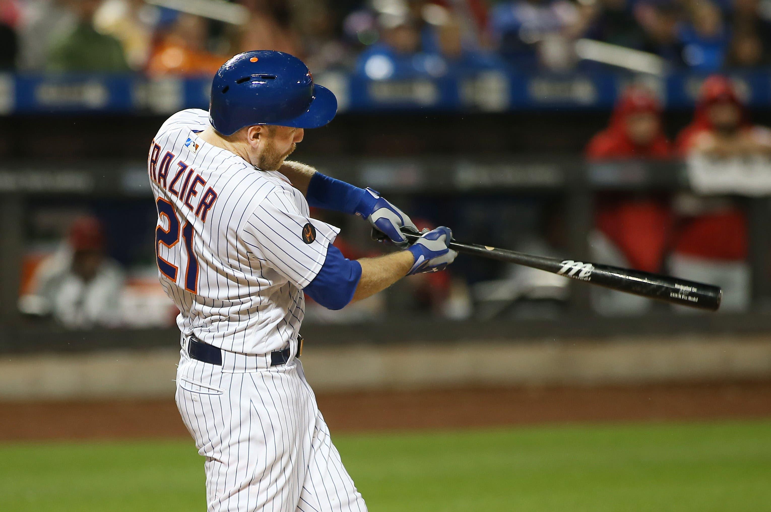 Sep 8, 2018; New York City, NY, USA; New York Mets third baseman Todd Frazier (21) hits an RBI sacrifice fly against the Philadelphia Phillies during the sixth inning at Citi Field. Mandatory Credit: Andy Marlin-USA TODAY Sports / Andy Marlin