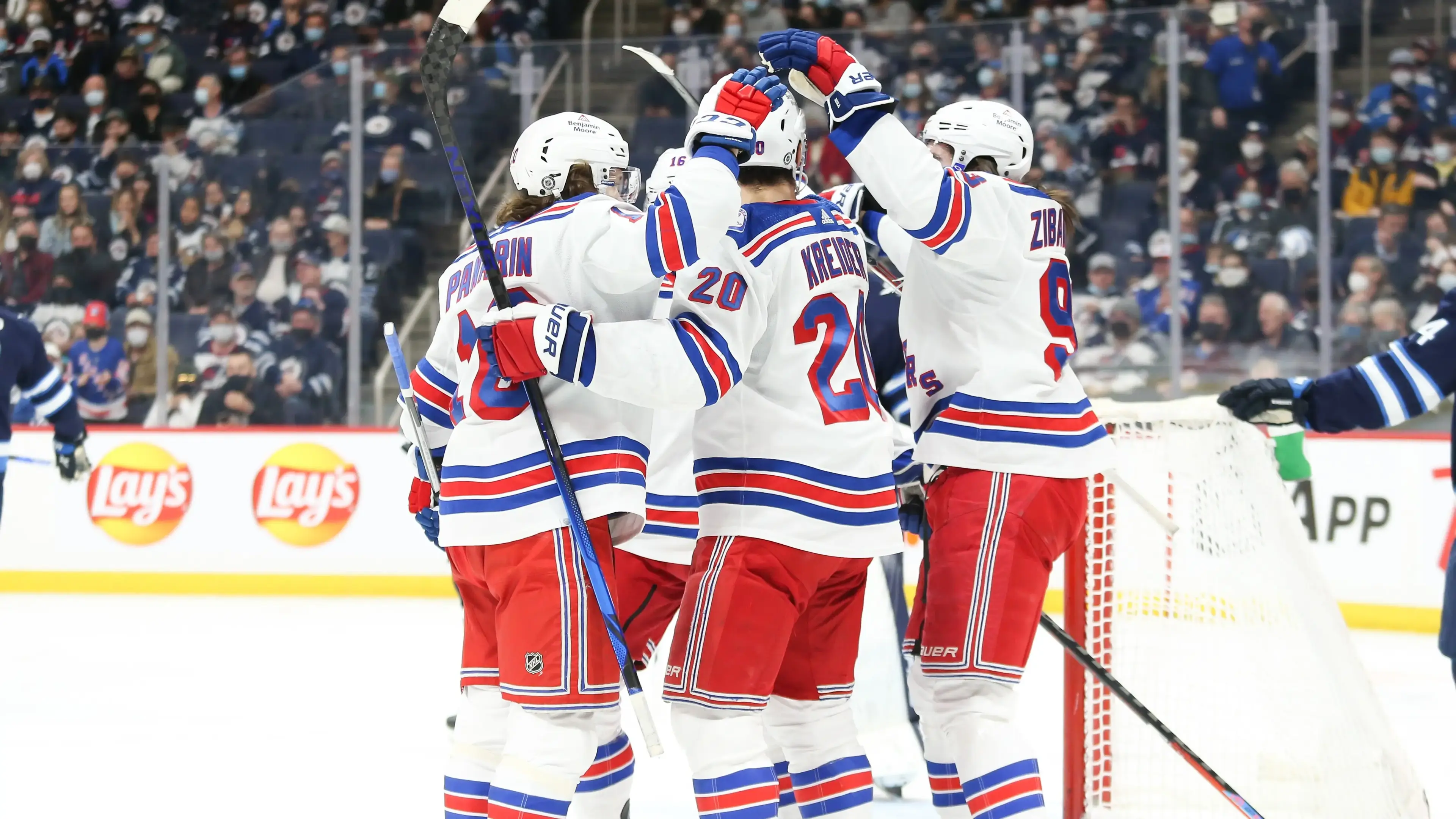 Mar 6, 2022; Winnipeg, Manitoba, CAN; New York Rangers forward Chris Kreider (20) is congratulated by his team mates after his goal against the Winnipeg Jets during the first period at Canada Life Centre. Mandatory Credit: Terrence Lee-USA TODAY Sports / Terrence Lee-USA TODAY Sports