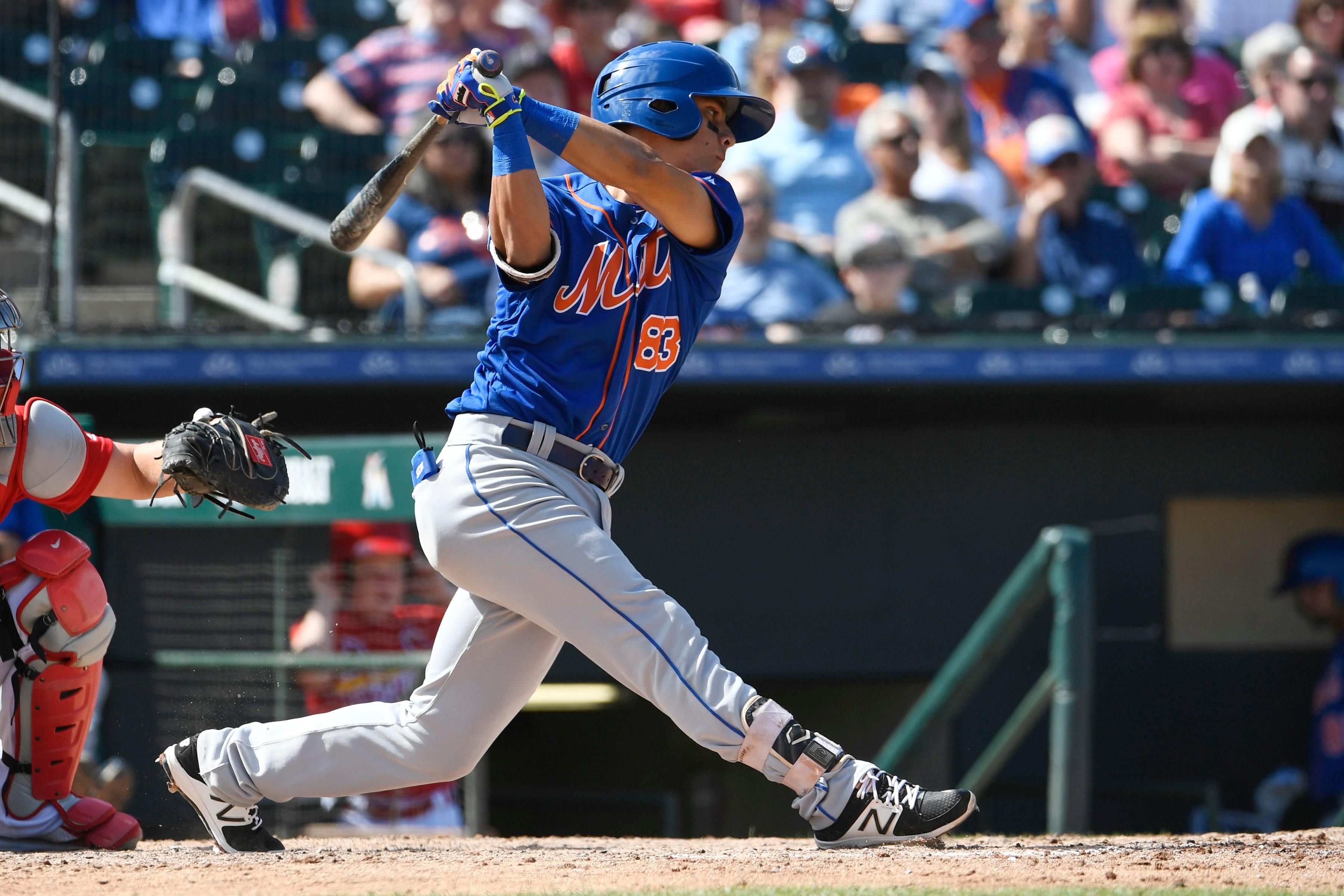 Mar 18, 2017; Jupiter, FL, USA; New York Mets shortstop Andres Gimenez (83) connects for a base hit against the St. Louis Cardinals during a spring training game at Roger Dean Stadium. The Mets defeated the Cardinals 5-4. Mandatory Credit: Scott Rovak-USA TODAY Sports