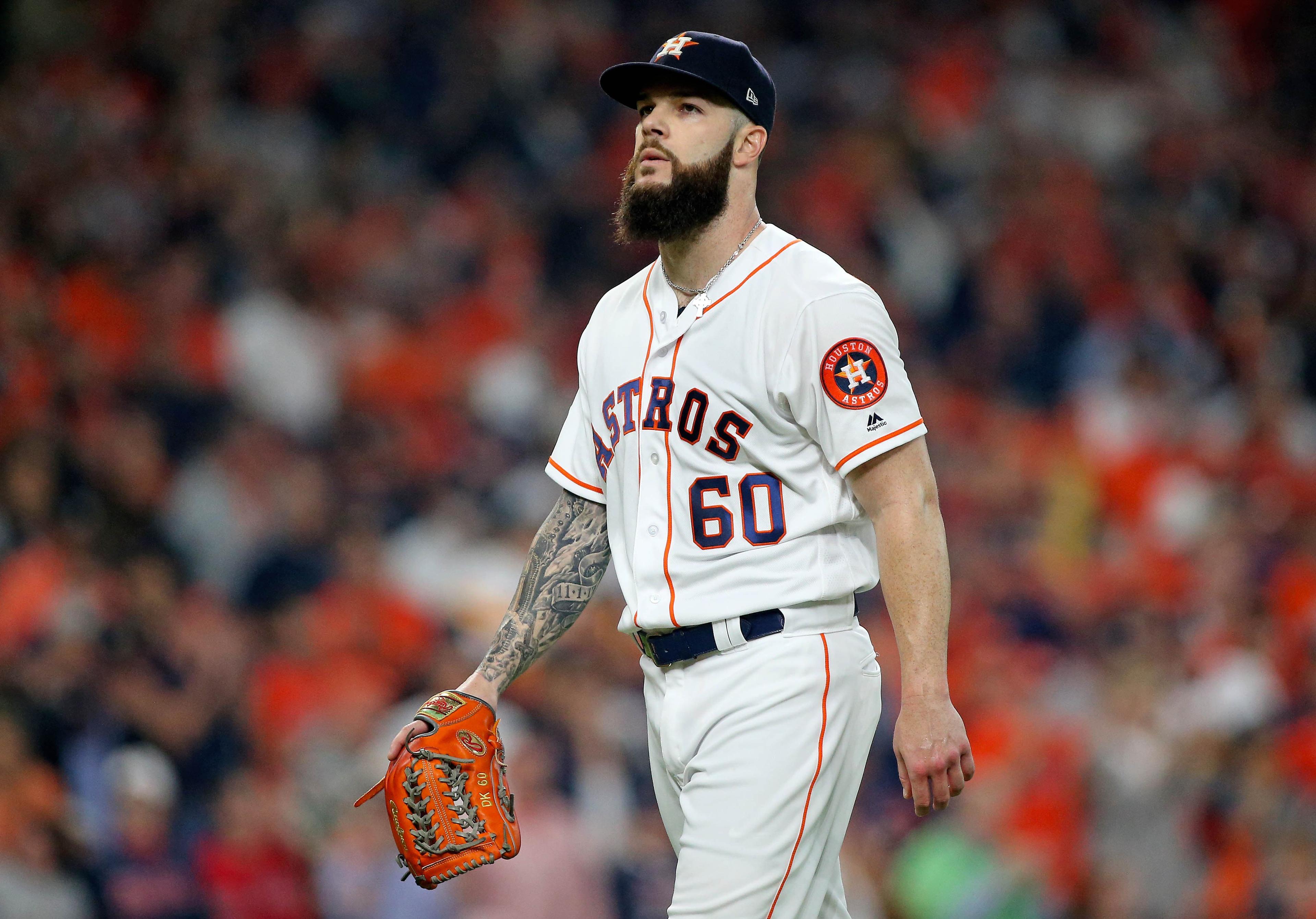 Oct 16, 2018; Houston, TX, USA; Houston Astros starting pitcher Dallas Keuchel (60) walks off the mound after the third out in the first inning of game three of the 2018 ALCS playoff baseball series against the Boston Red Sox at Minute Maid Park. Mandatory Credit: Troy Taormina-USA TODAY Sports / Troy Taormina