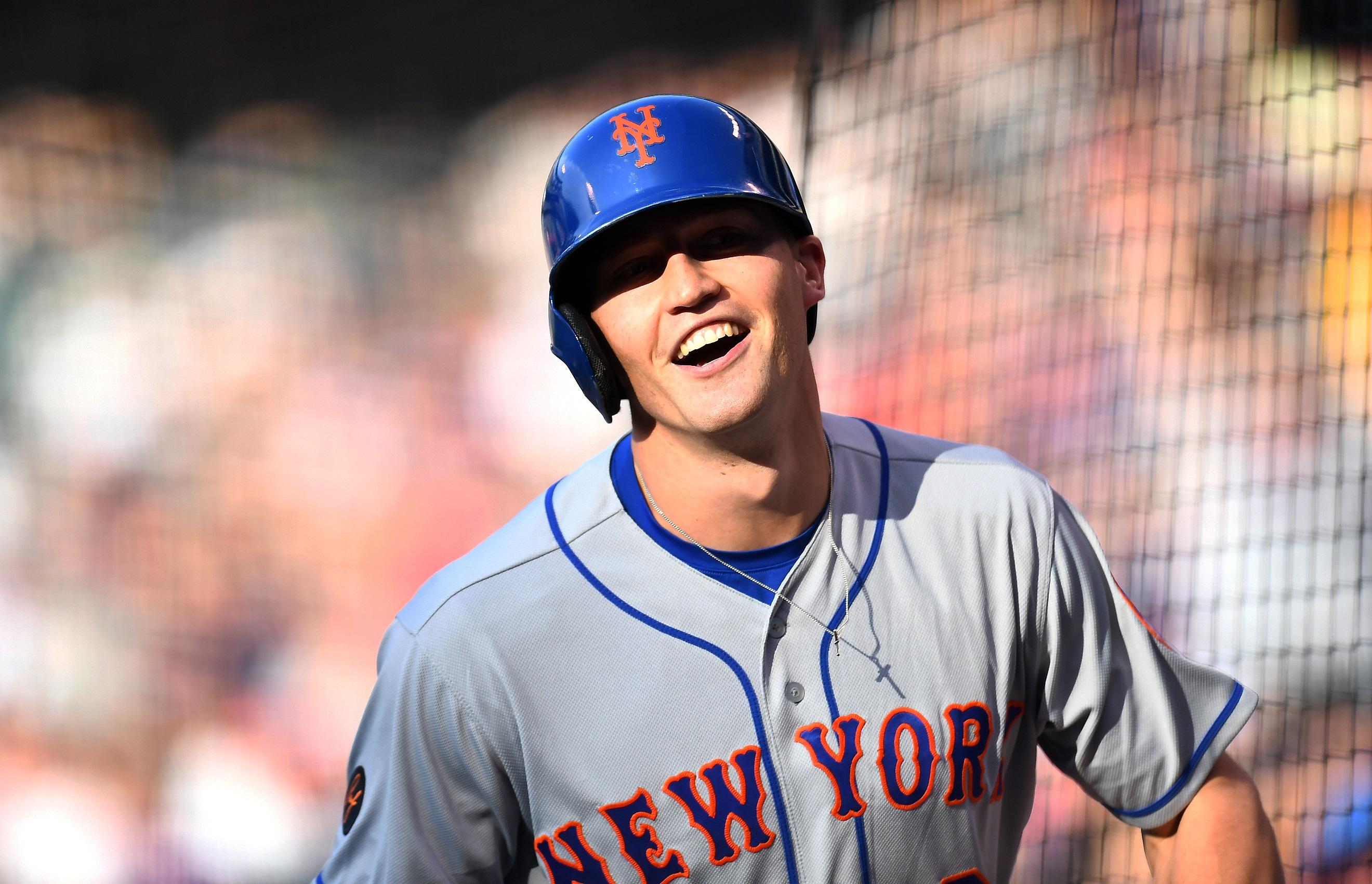 Jun 24, 2018; New York City, NY, USA; New York Mets manager Mickey Callaway (36) looks on as center fielder Brandon Nimmo (9) is checked by a trainer after being hit by a pitch during the fifth inning against the Los Angeles Dodgers at Citi Field. Mandatory Credit: Anthony Gruppuso-USA TODAY Sports
