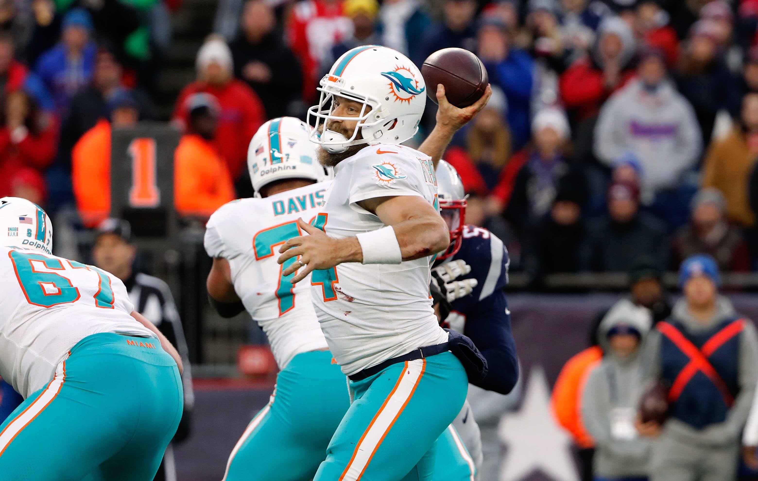 Dec 29, 2019; Foxborough, Massachusetts, USA; Miami Dolphins quarterback Ryan Fitzpatrick (14) throws against the New England Patriots during the second half at Gillette Stadium. Mandatory Credit: Winslow Townson-USA TODAY Sports / Winslow Townson