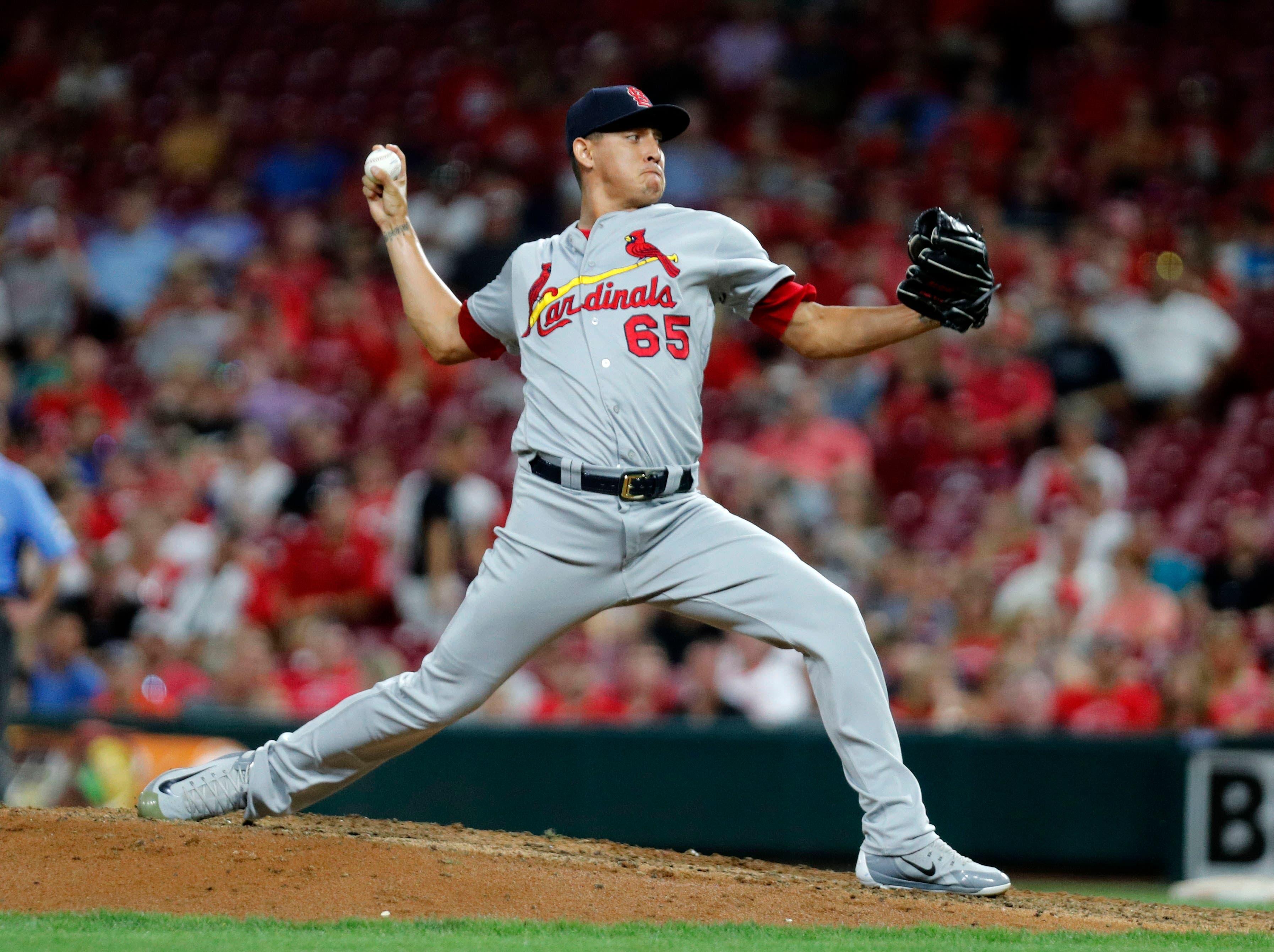 Aug 16, 2019; Cincinnati, OH, USA; St. Louis Cardinals relief pitcher Giovanny Gallegos (65) throws against the Cincinnati Reds during the ninth inning at Great American Ball Park. Mandatory Credit: David Kohl-USA TODAY Sports / David Kohl