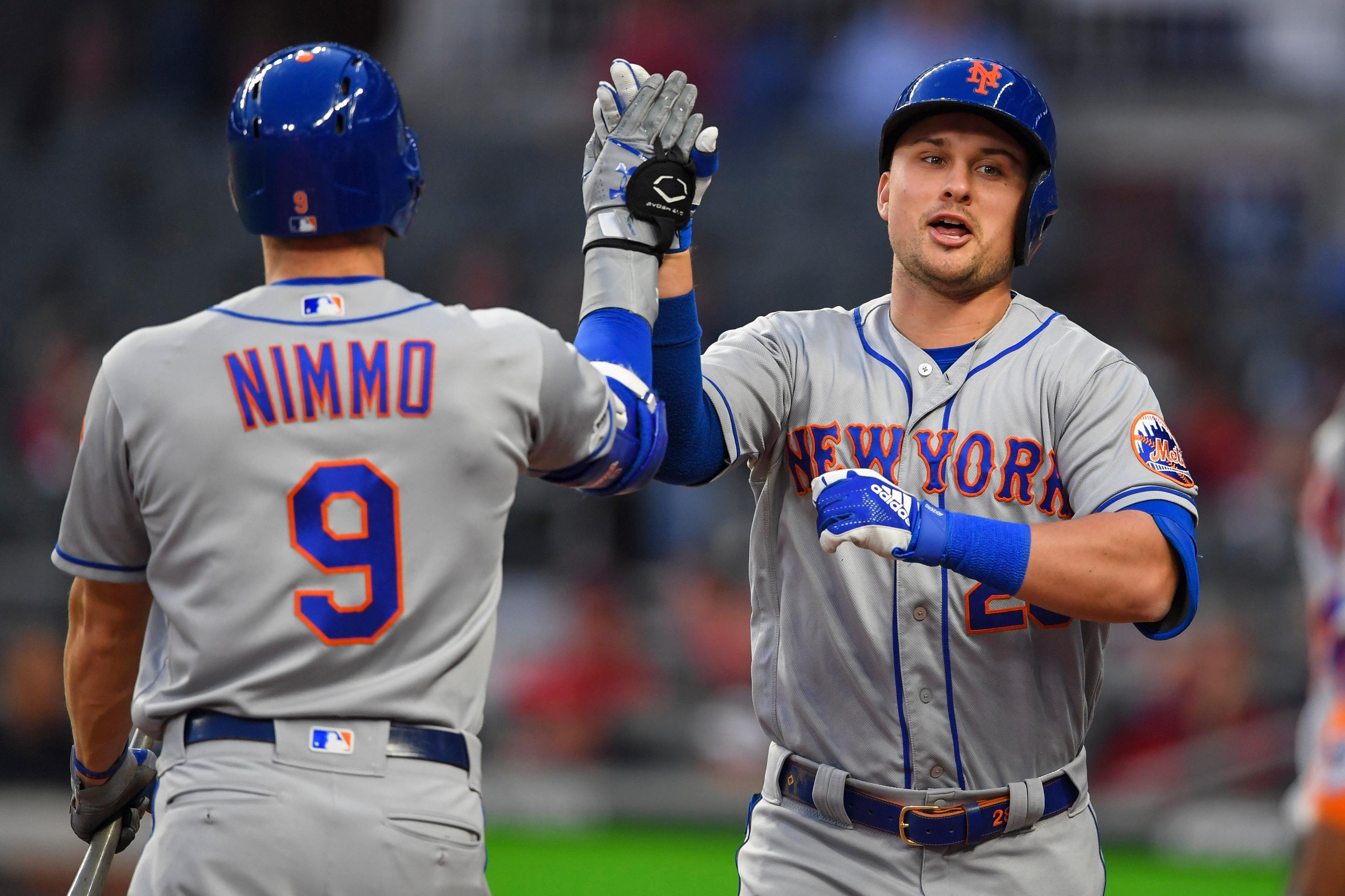 Apr 14, 2019; Atlanta, GA, USA; New York Mets third baseman J.D. Davis (28) reacts with center fielder Brandon Nimmo (9) after hitting a home run against the Atlanta Braves during the second inning at SunTrust Park. Mandatory Credit: Dale Zanine-USA TODAY Sports / Dale Zanine