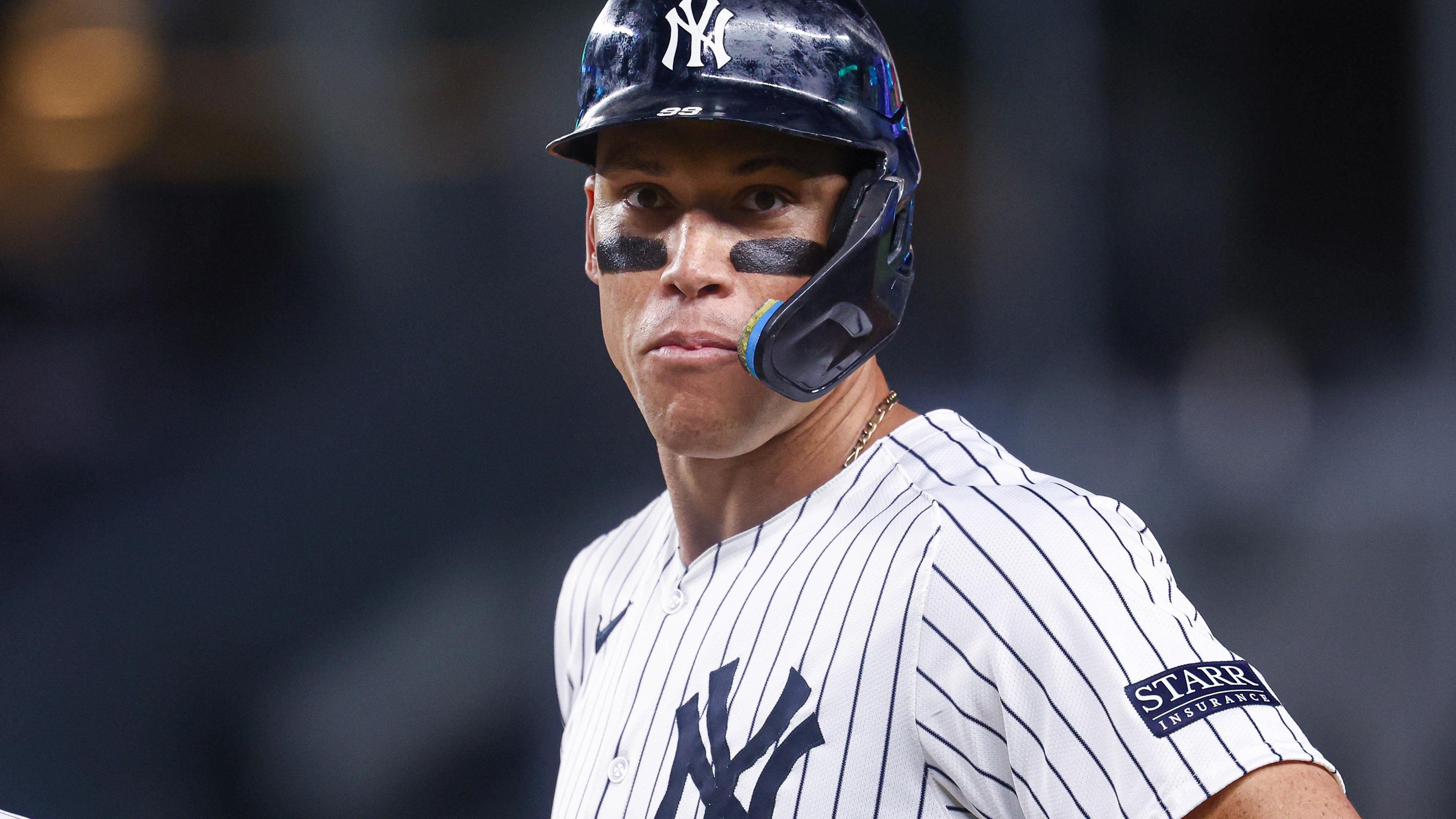 New York Yankees center fielder Aaron Judge (99) looks back while standing on first base during the sixth inning against the Baltimore Orioles at Yankee Stadium / Vincent Carchietta - Imagn Images