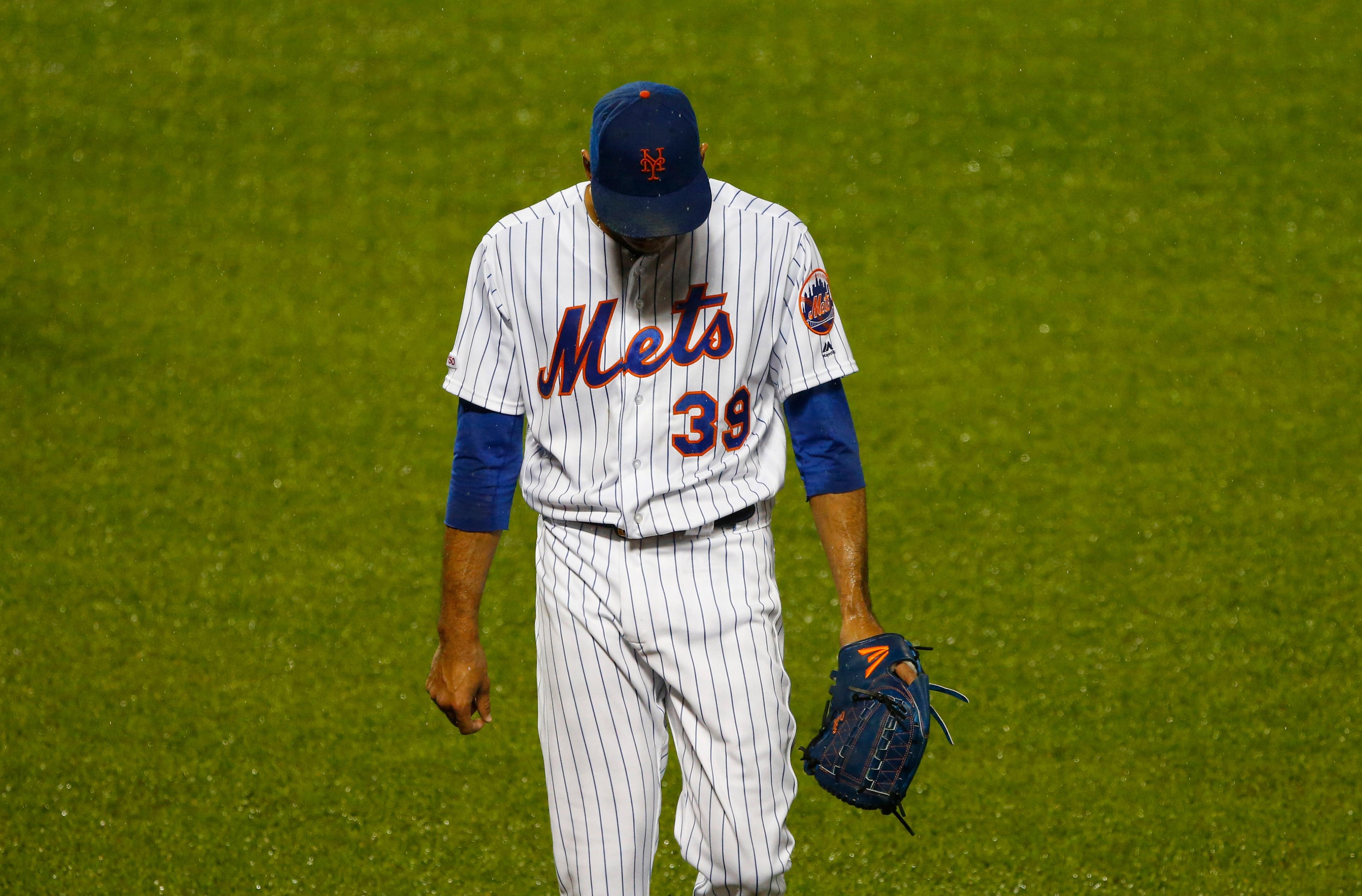 Umpires explain why they let Mets game continue in downpour as Edwin Diaz blew save