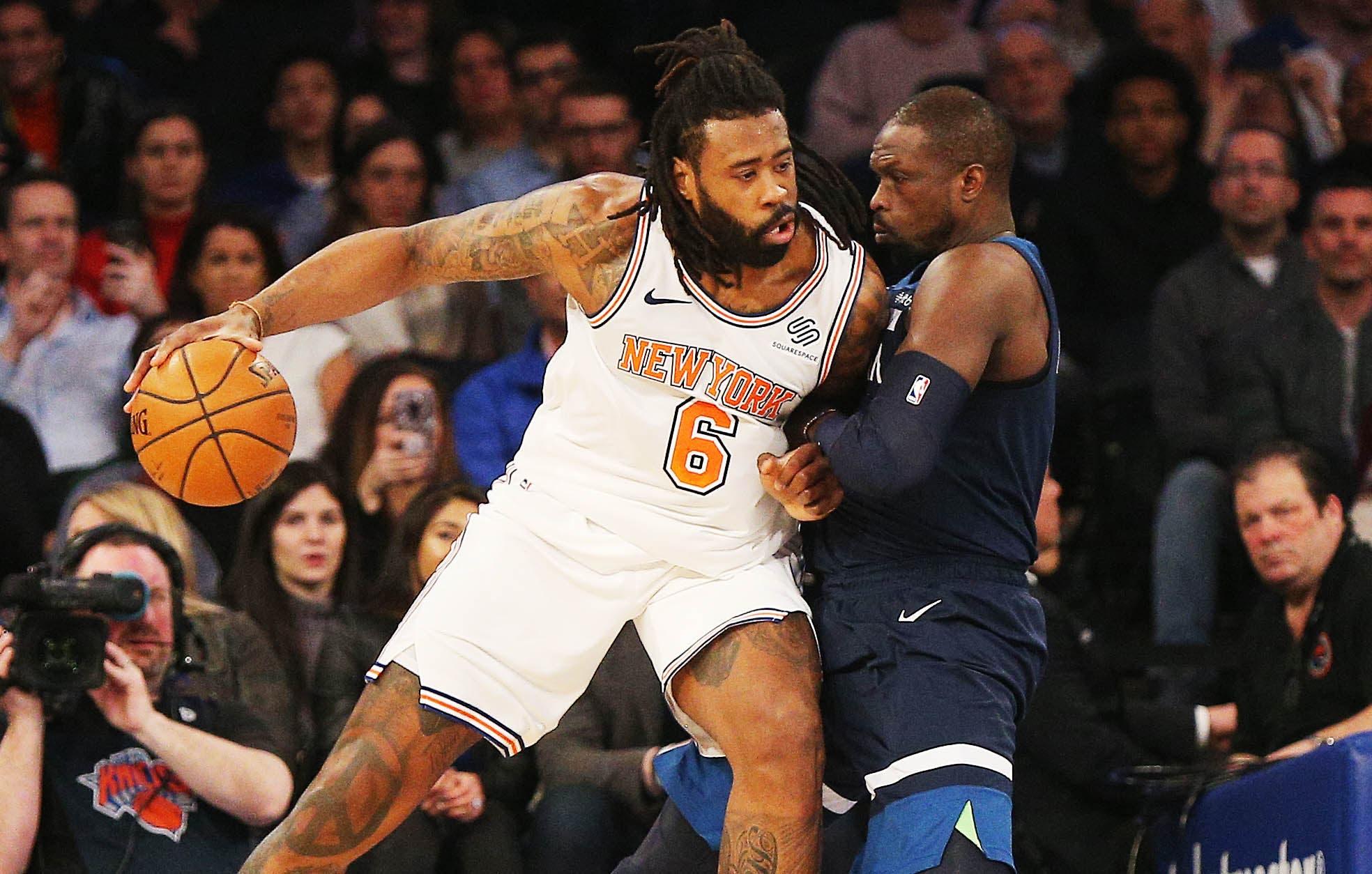 New York Knicks center DeAndre Jordan dribbles the ball against Minnesota Timberwolves forward Luol Deng during the first half at Madison Square Garden. / Andy Marlin/USA TODAY Sports