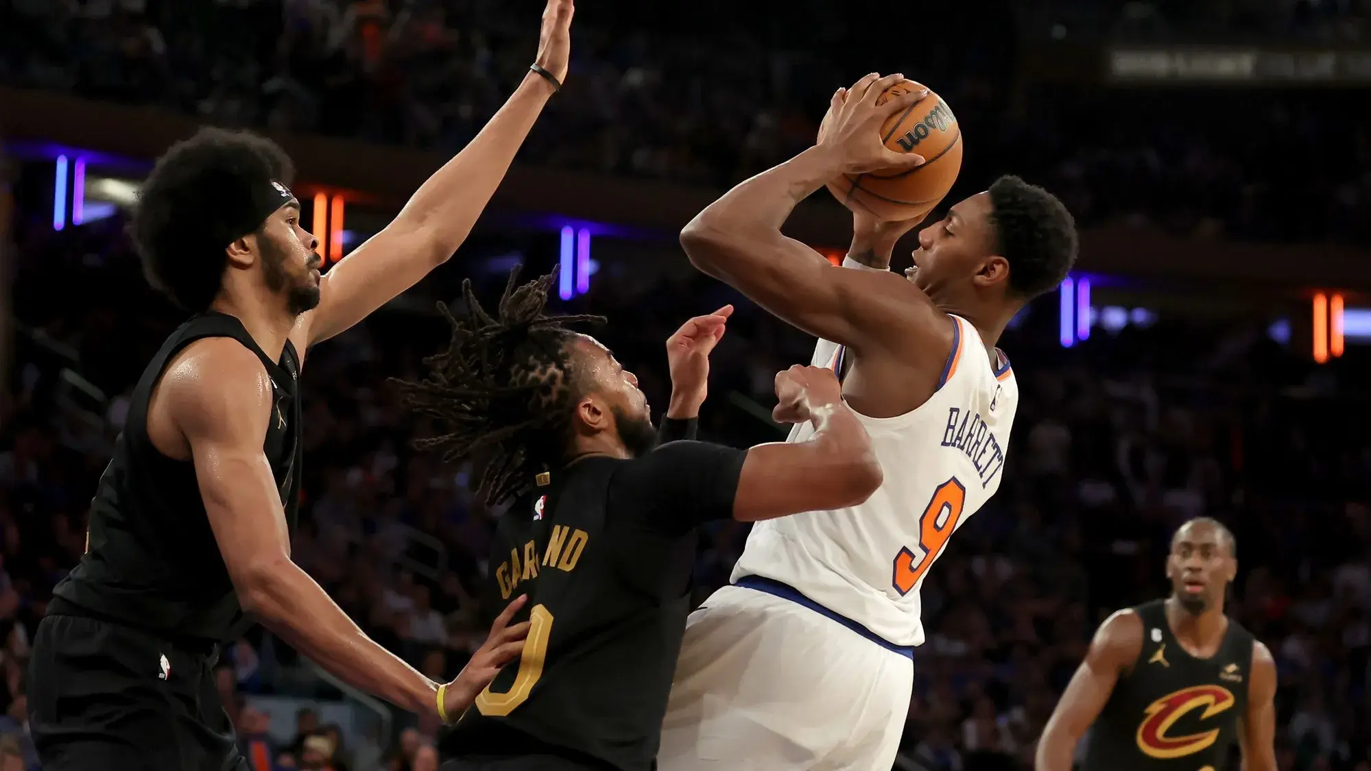 Apr 21, 2023; New York, New York, USA; New York Knicks guard RJ Barrett (9) drives to the basket against Cleveland Cavaliers center Jarrett Allen (31) and guards Darius Garland (10) and Caris LeVert (3) during the fourth quarter of game three of the 2023 NBA playoffs at Madison Square Garden. / Brad Penner-USA TODAY Sports