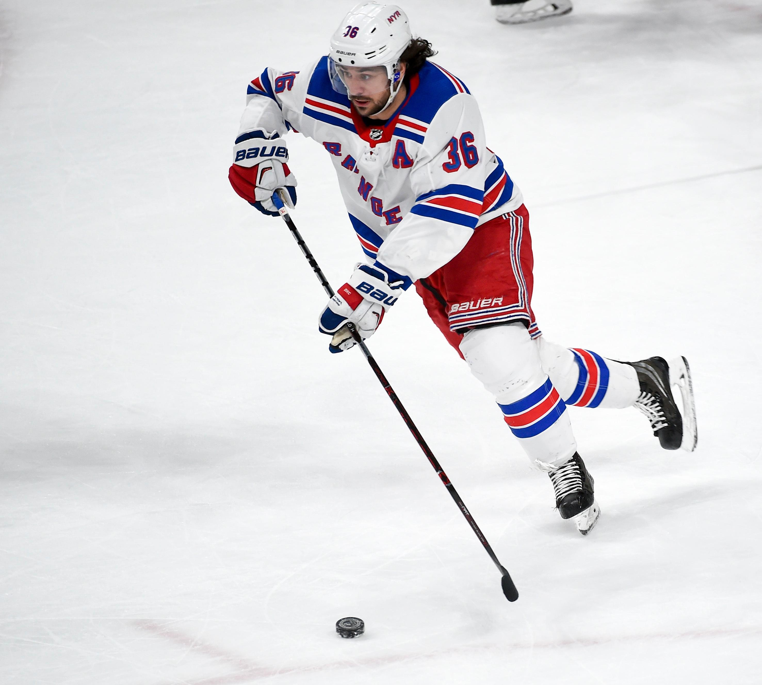 Mats Zuccarello brings the puck up the ice. 