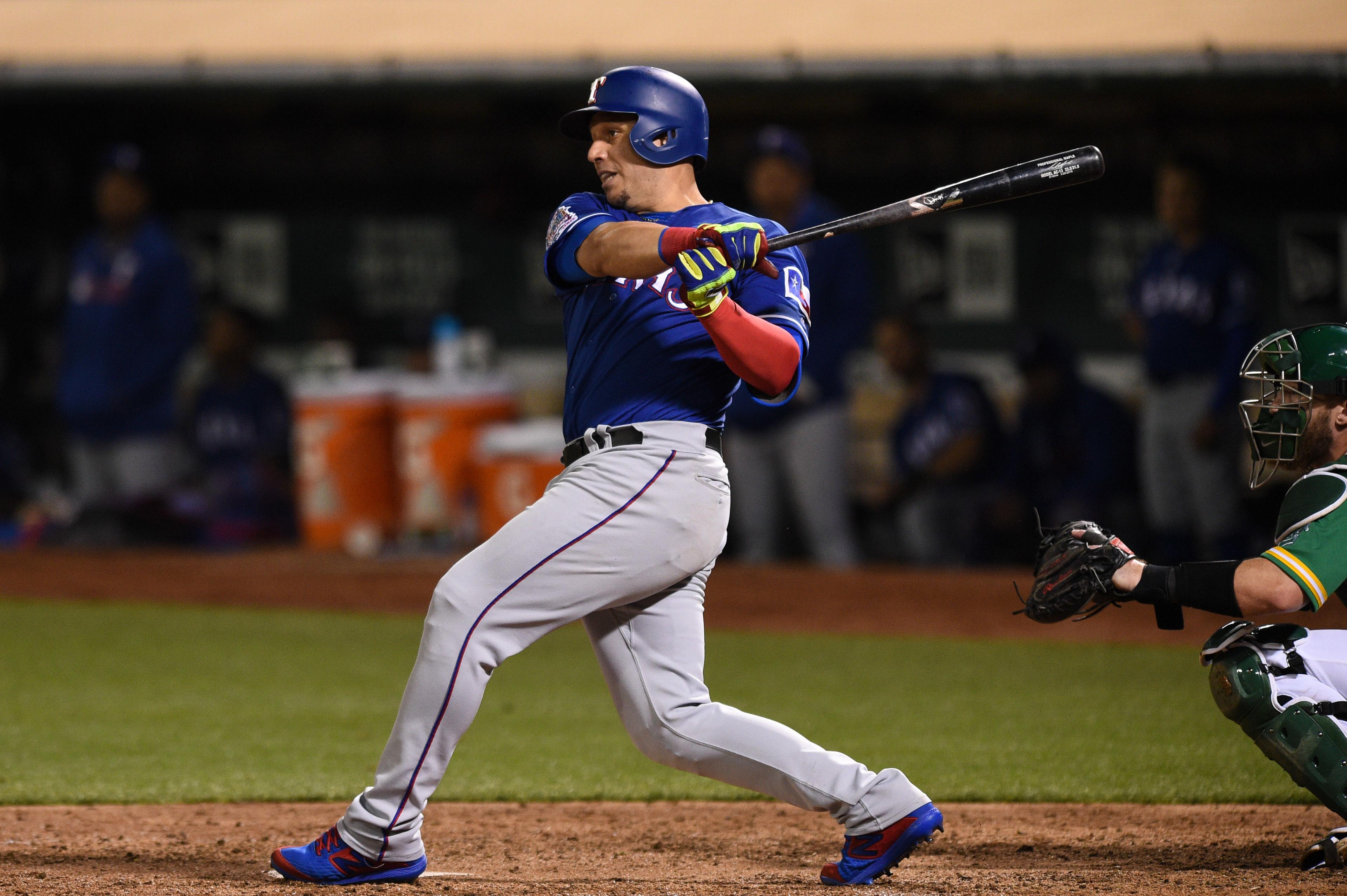 Jul 26, 2019; Oakland, CA, USA; Texas Rangers infielder Asdrubal Cabrera (14) hits against the Oakland Athletics at Oakland Coliseum. Mandatory Credit: Cody Glenn-USA TODAY Sports