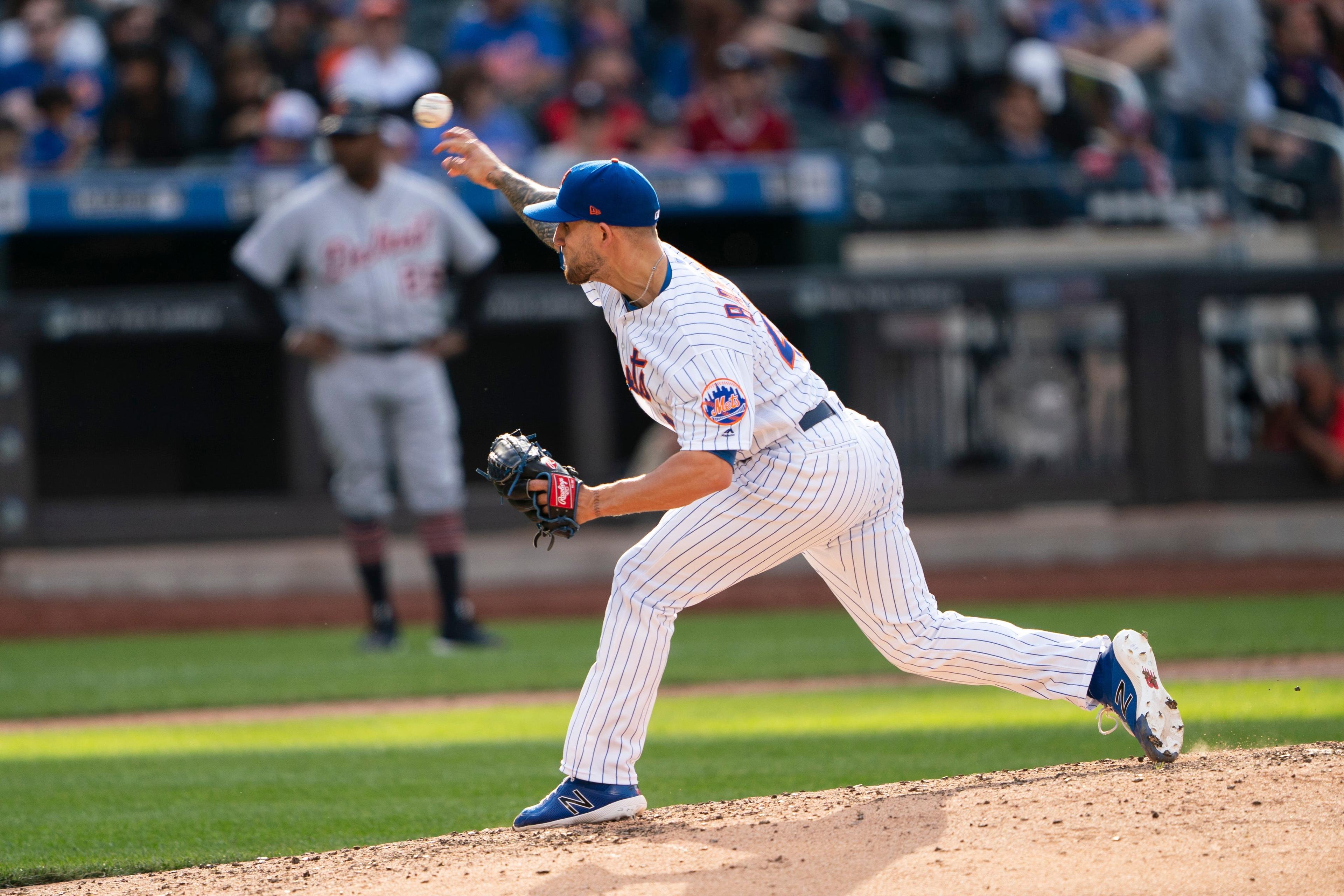 Tyler Bashlor fires a pitch to home plate / USA TODAY