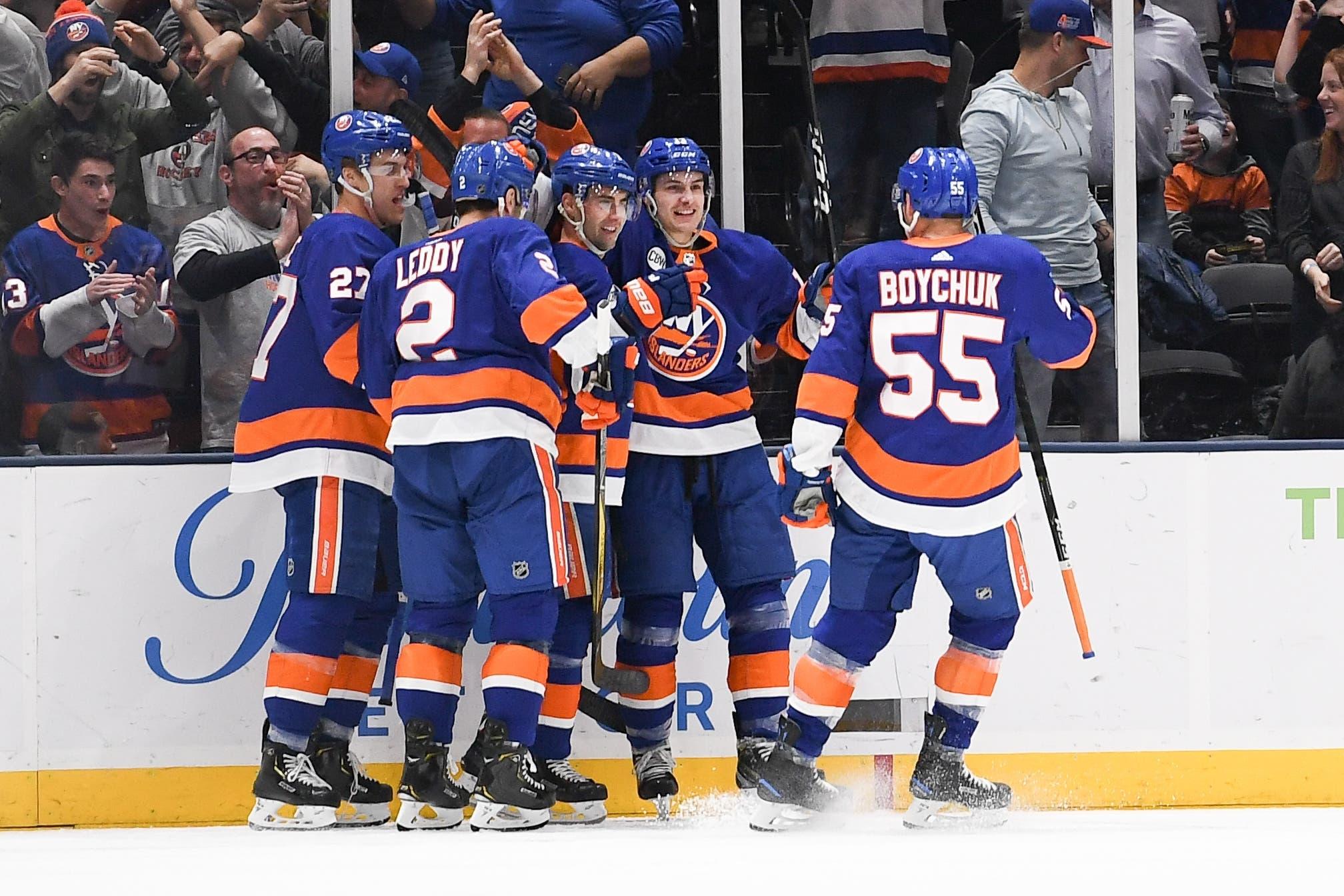 Mar 30, 2019; Uniondale, NY, USA; New York Islanders celebrate the goal by New York Islanders right wing Jordan Eberle (7) against the Buffalo Sabres during the first period at Nassau Veterans Memorial Coliseum. Mandatory Credit: Dennis Schneidler-USA TODAY Sports / Dennis Schneidler