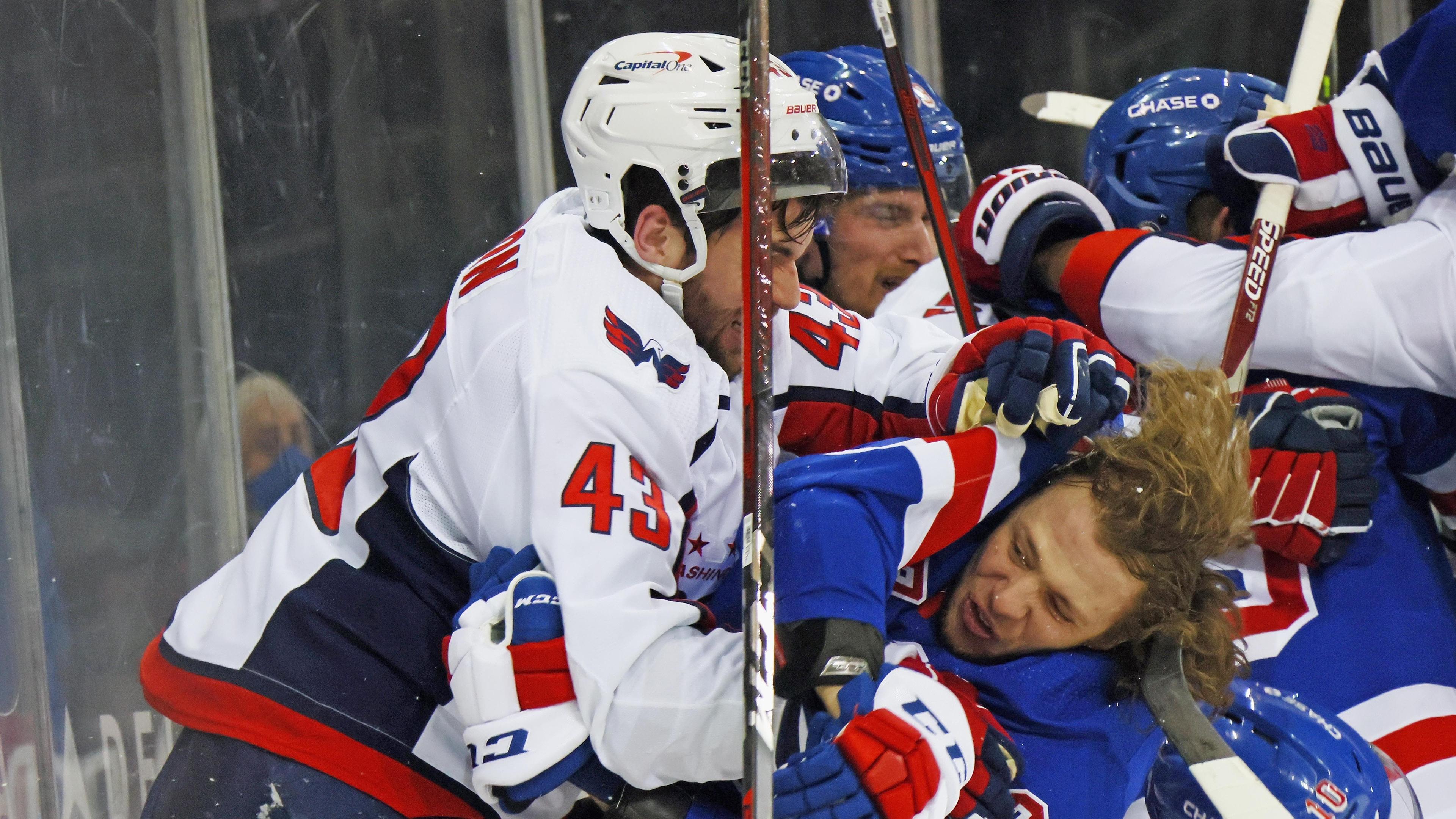 Tom Wilson #43 of the Washington Capitals takes a roughing penalty during the second period against Artemi Panarin #10 of the New York Rangers at Madison Square Garden. / Bruce Bennett-USA TODAY Sports