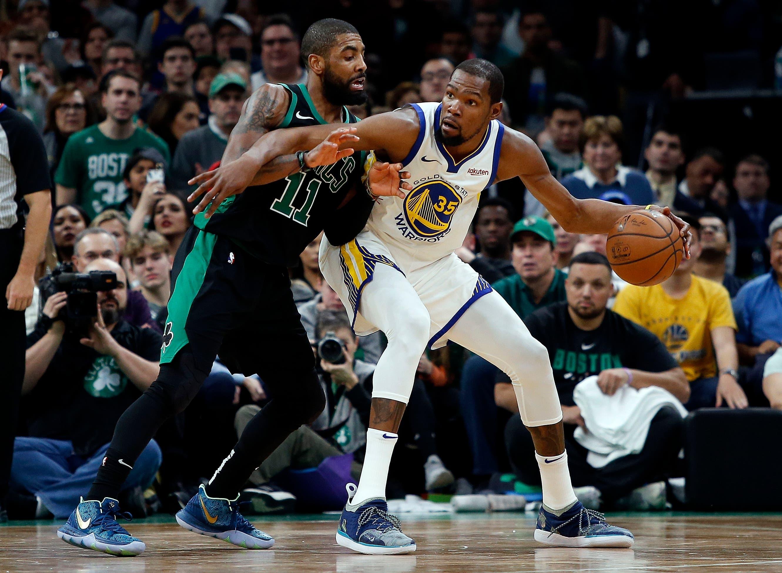 Jan 26, 2019; Boston, MA, USA; Golden State Warriors forward Kevin Durant (35) works against Boston Celtics guard Kyrie Irving (11) during the second half of a 115-111 victory by Golden State at TD Garden. Mandatory Credit: Winslow Townson-USA TODAY Sports / Winslow Townson