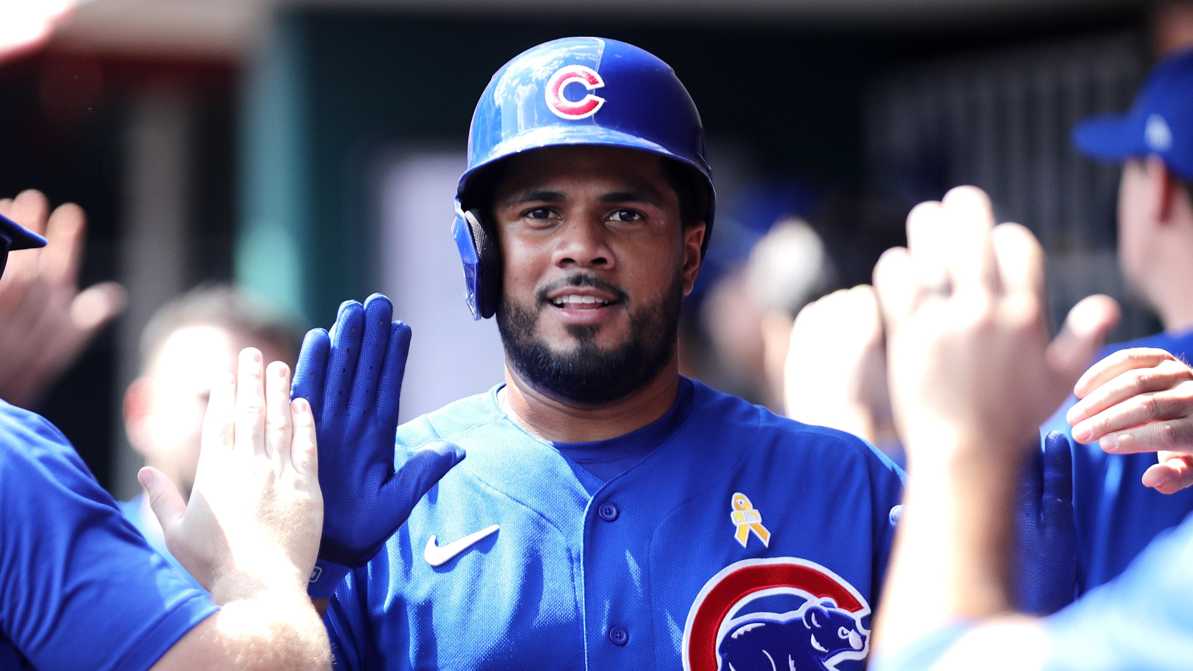 Sep 3, 2023; Cincinnati, Ohio, USA; Chicago Cubs third baseman Jeimer Candelario (9) reacts in the dugout after scoring against the Cincinnati Reds during the eighth inning at Great American Ball Park. Mandatory Credit: David Kohl-USA TODAY Sports / © David Kohl-USA TODAY Sports