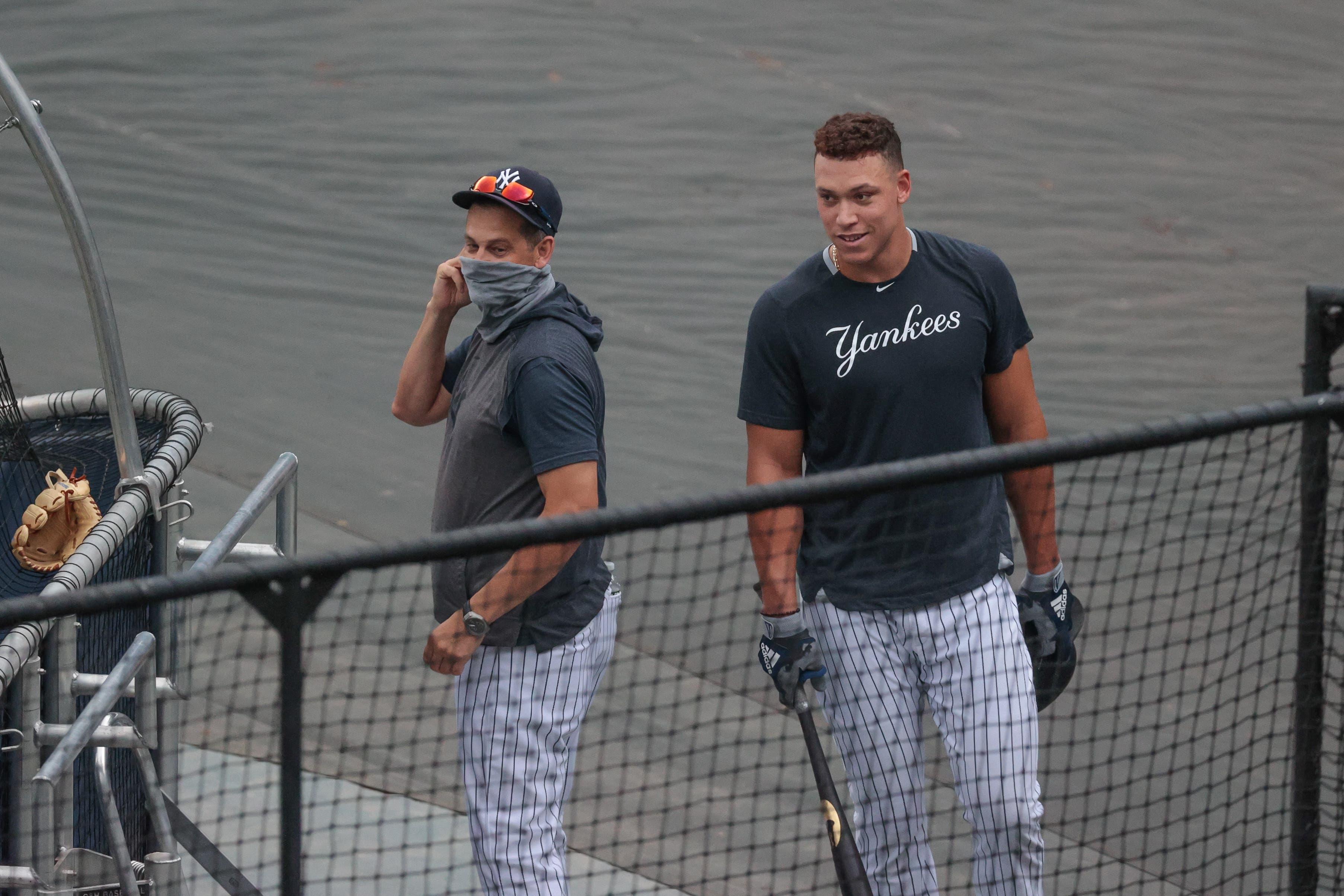 Yankees manager Aaron Boone with Aaron Judge / USA TODAY