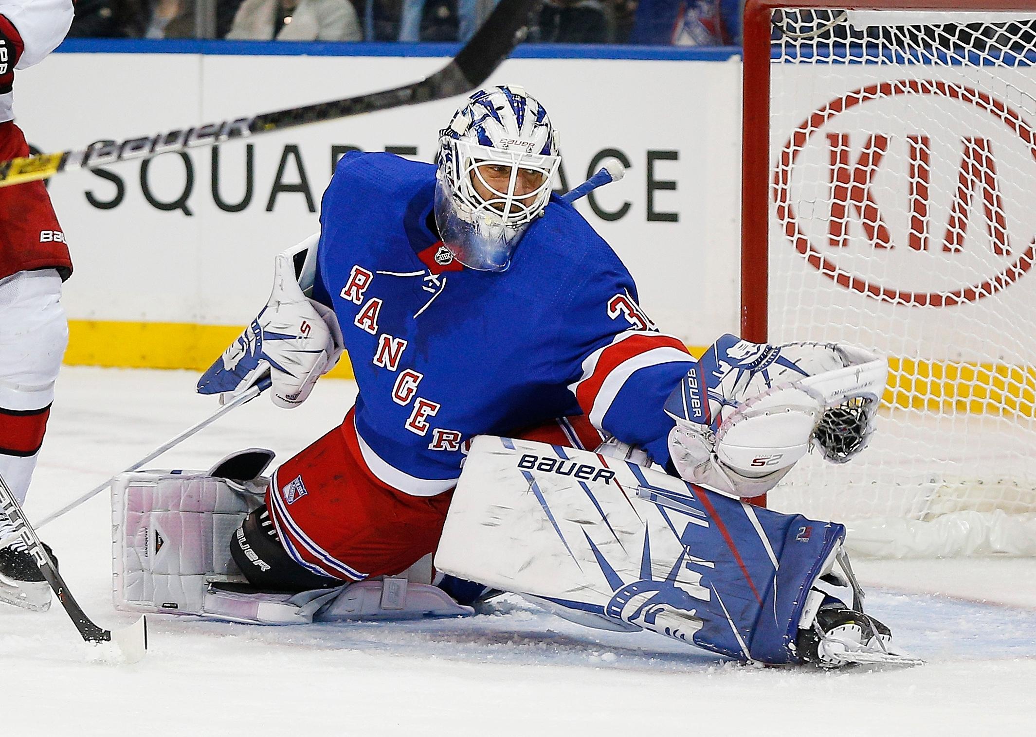 Nov 27, 2019; New York, NY, USA; New York Rangers goaltender Henrik Lundqvist (30) makes a glove save against the Carolina Hurricanes during the first period at Madison Square Garden. Mandatory Credit: Andy Marlin-USA TODAY Sports