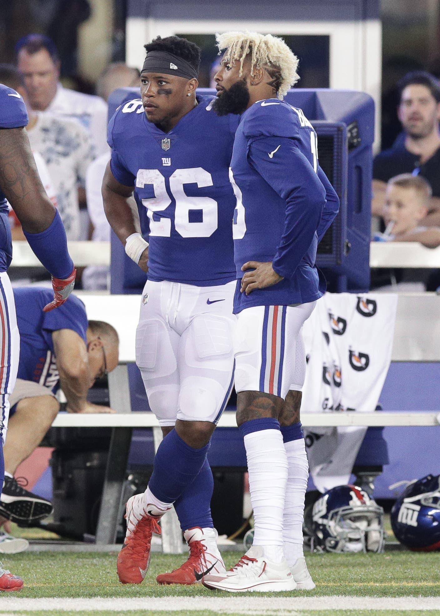 Aug 9, 2018; East Rutherford, NJ, USA; New York Giants running back Saquon Barkley (26) talks with wide receiver Odell Beckham (13) during the first half at MetLife Stadium. Mandatory Credit: Vincent Carchietta-USA TODAY Sports / Vincent Carchietta