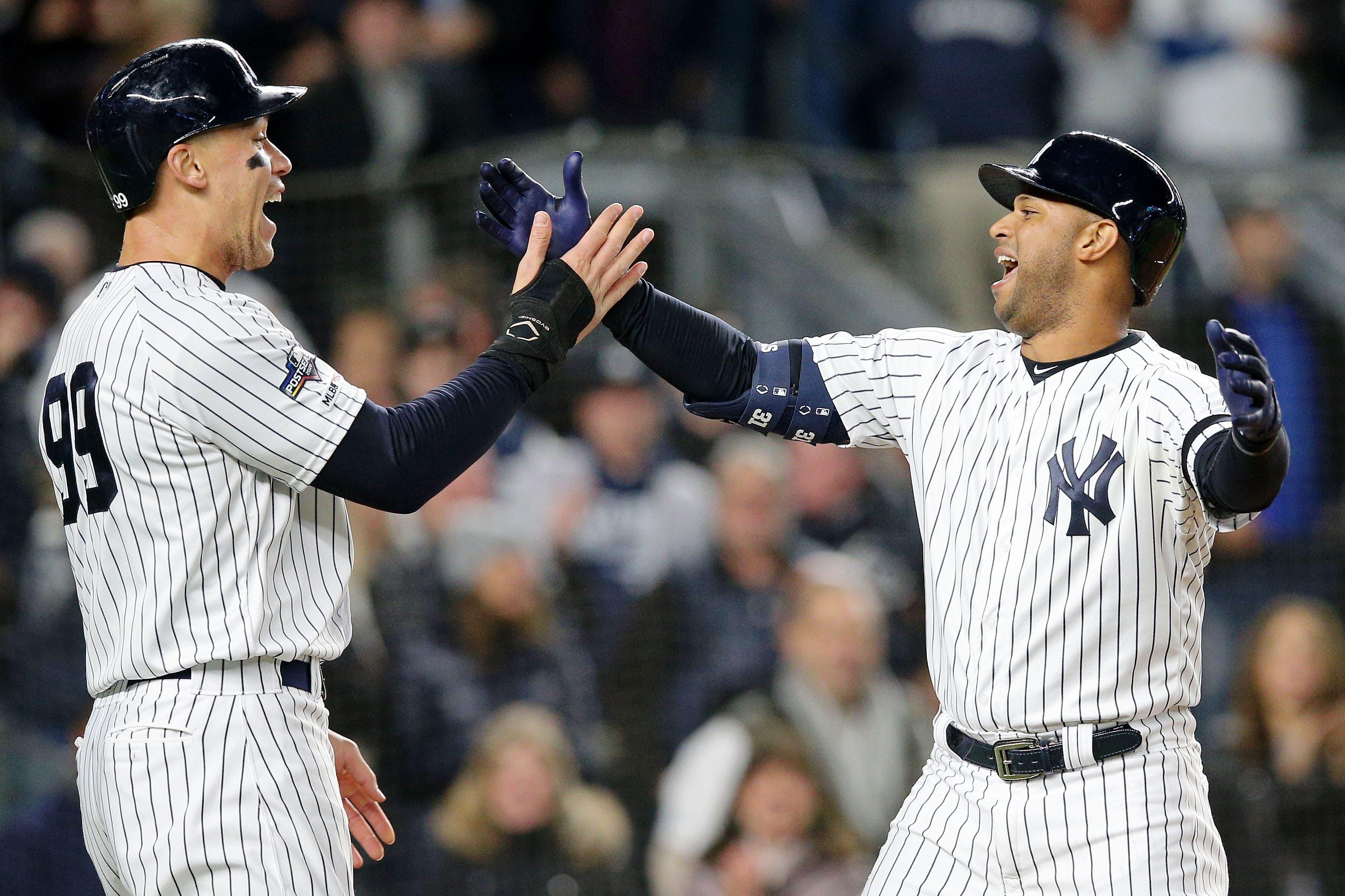 Aaron Judge and Aaron Hicks celebrate after scoring at Yankee Stadium / USA TODAY Sports