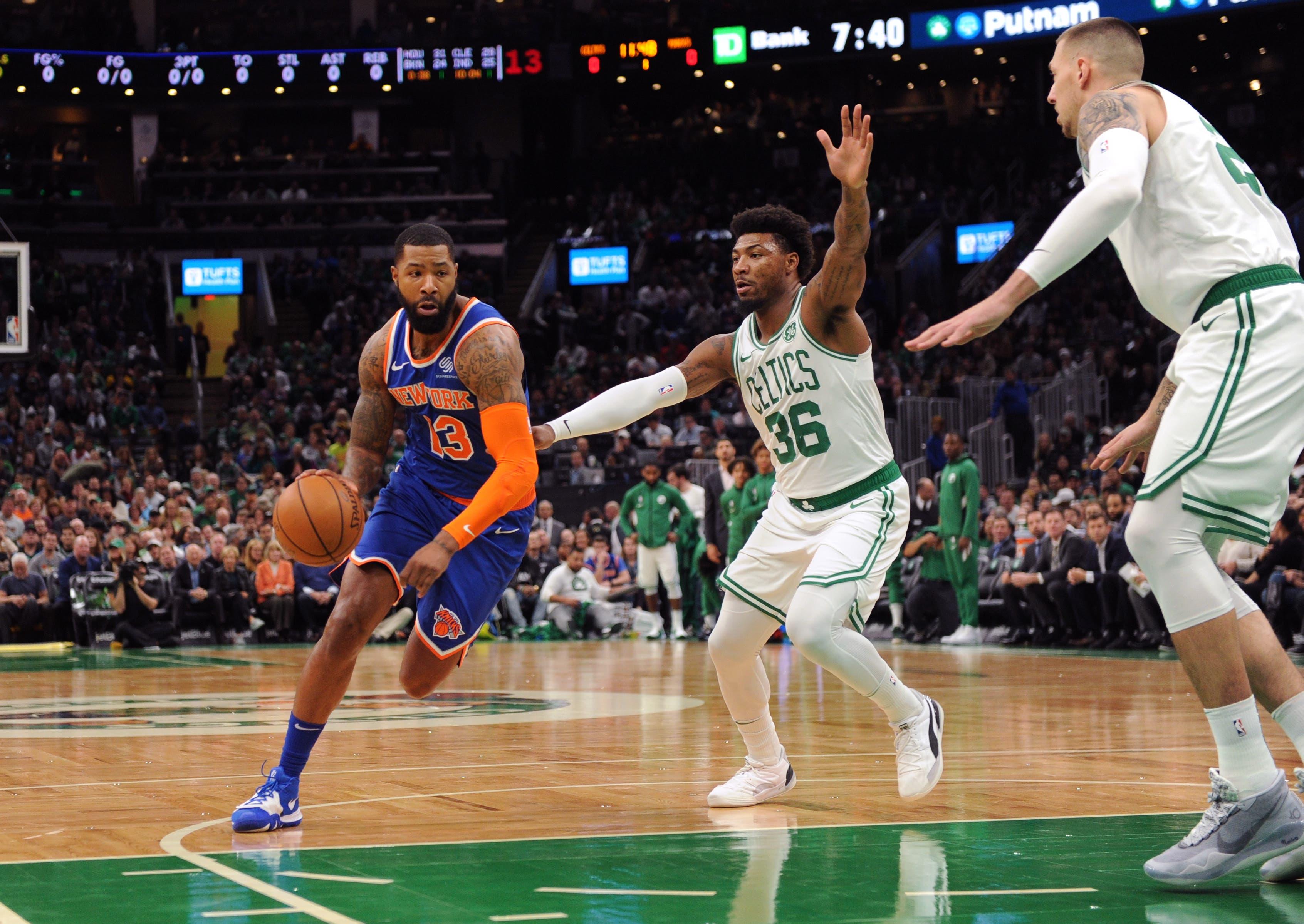 Nov 1, 2019; Boston, MA, USA; New York Knicks forward Marcus Morris Sr. (13) controls the ball while Boston Celtics guard Marcus Smart (36) defends during the first half at TD Garden. Mandatory Credit: Bob DeChiara-USA TODAY Sports / Bob DeChiara