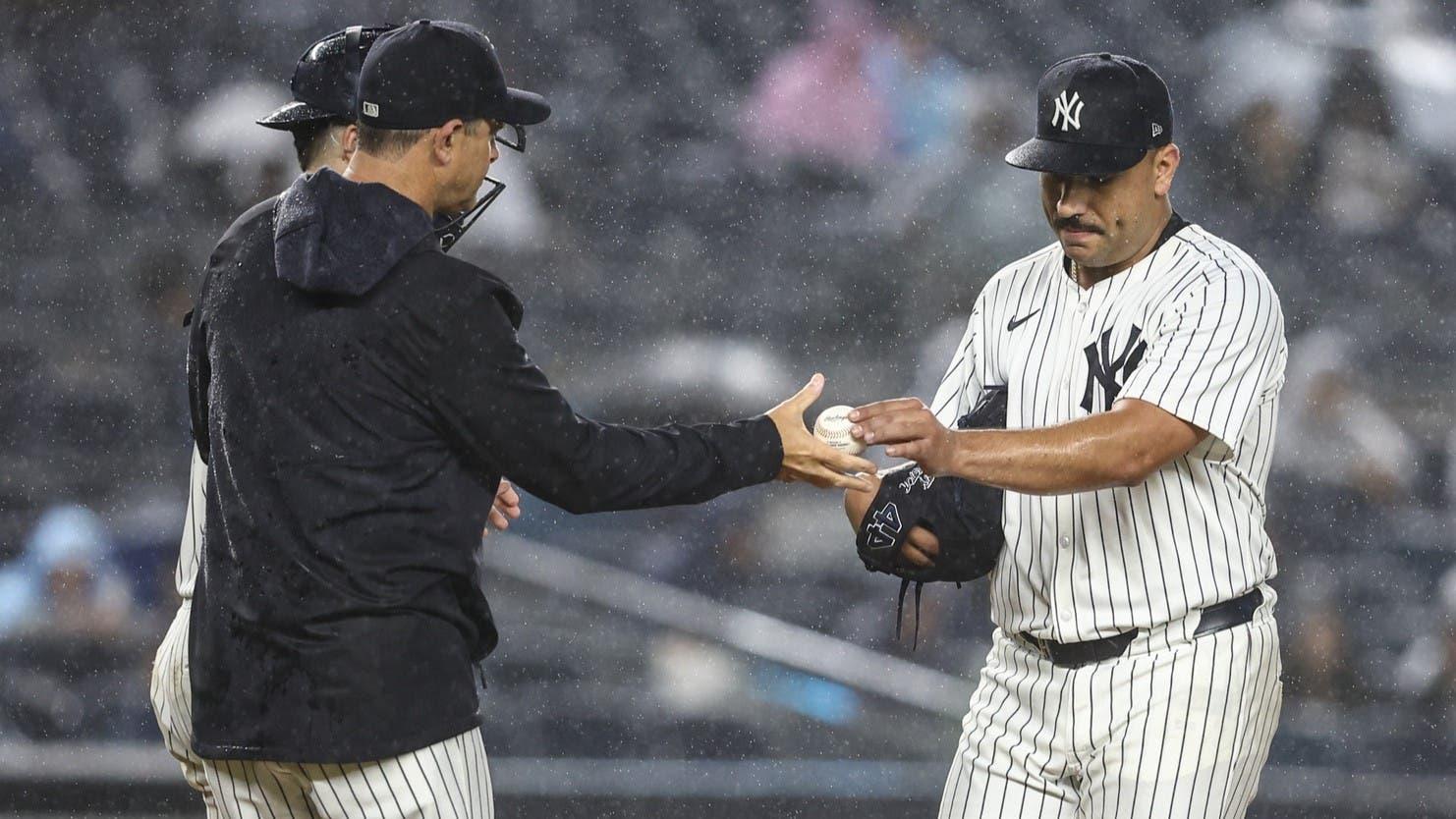 Aug 8, 2024; Bronx, New York, USA; New York Yankees starting pitcher Nestor Cortes (65) is taken out of the game by manager Aaron Boone (17) in the fifth inning against the Los Angeles Angels at Yankee Stadium. / Wendell Cruz-USA TODAY Sports