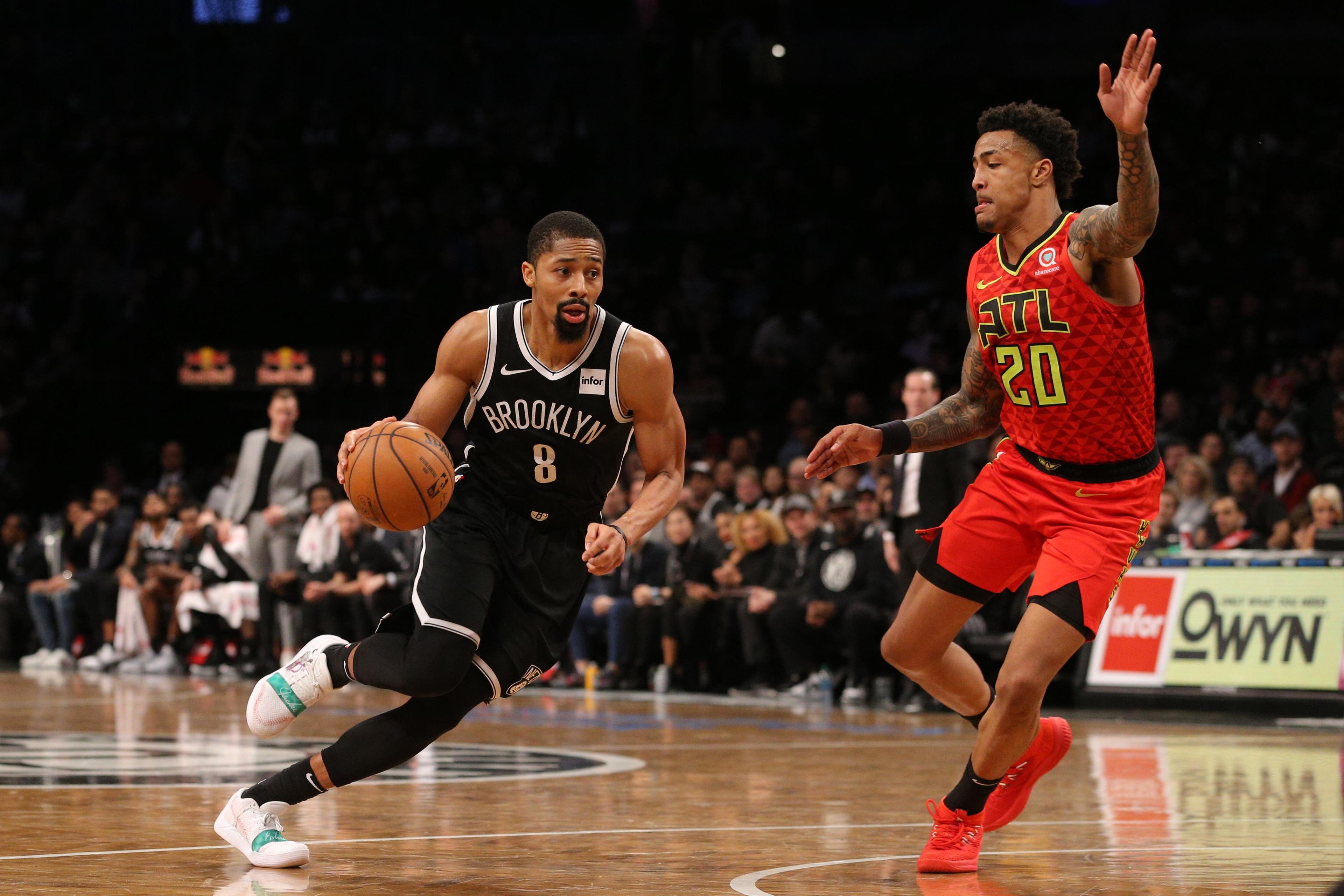 Jan 9, 2019; Brooklyn, NY, USA; Brooklyn Nets point guard Spencer Dinwiddie (8) drives against Atlanta Hawks power forward John Collins (20) during the fourth quarter at Barclays Center. Mandatory Credit: Brad Penner-USA TODAY Sports / Brad Penner