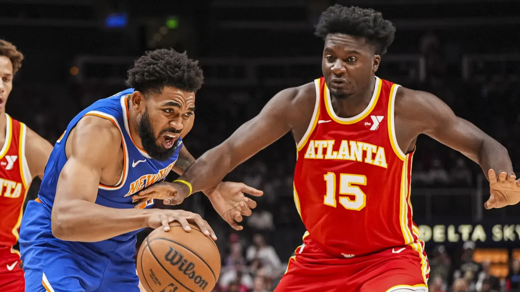 Nov 6, 2024; Atlanta, Georgia, USA; New York Knicks center Karl-Anthony Towns (32) dribbles Atlanta Hawks center Clint Capela (15) during the first half at State Farm Arena. / Dale Zanine-Imagn Images