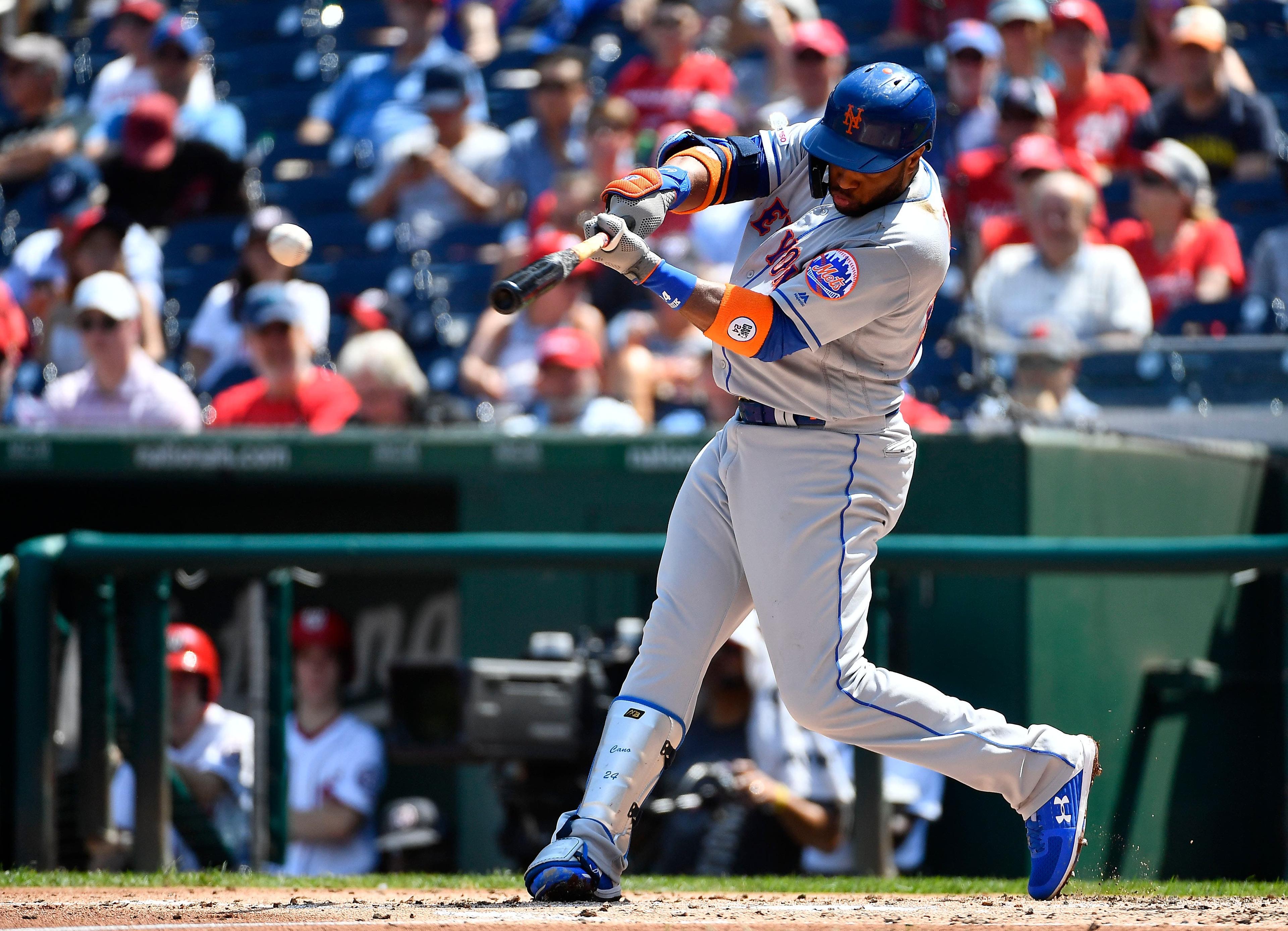 Sep 4, 2019; Washington, DC, USA; New York Mets second baseman Robinson Cano (24) singles against the Washington Nationals during the second inning at Nationals Park. Mandatory Credit: Brad Mills-USA TODAY Sports / Brad Mills