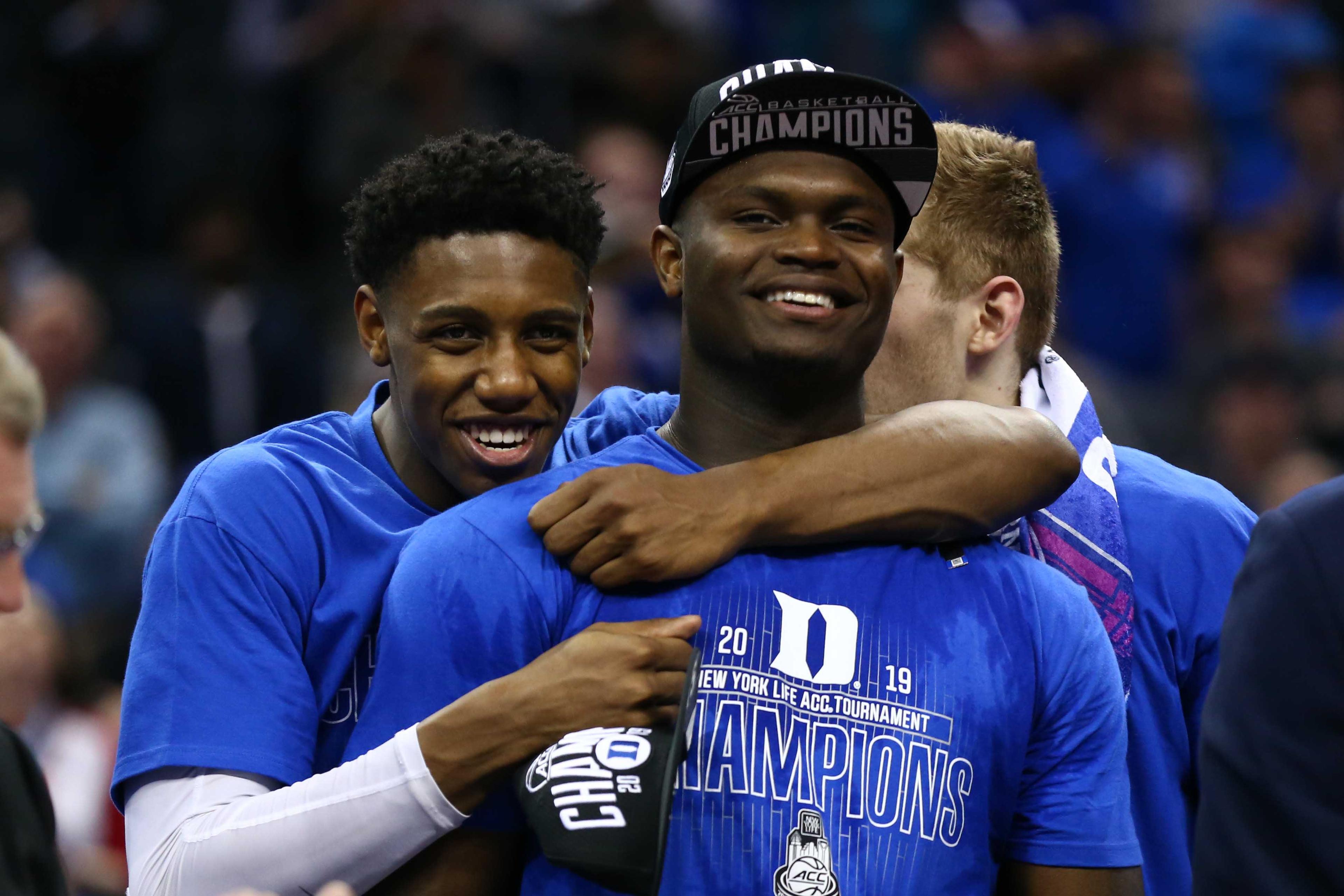 Mar 16, 2019; Charlotte, NC, USA; Duke Blue Devils forward RJ Barrett (5) hugs forward Zion Williamson (1) after defeating the Florida State Seminoles in the ACC conference tournament at Spectrum Center. Mandatory Credit: Jeremy Brevard-USA TODAY Sports / Jeremy Brevard