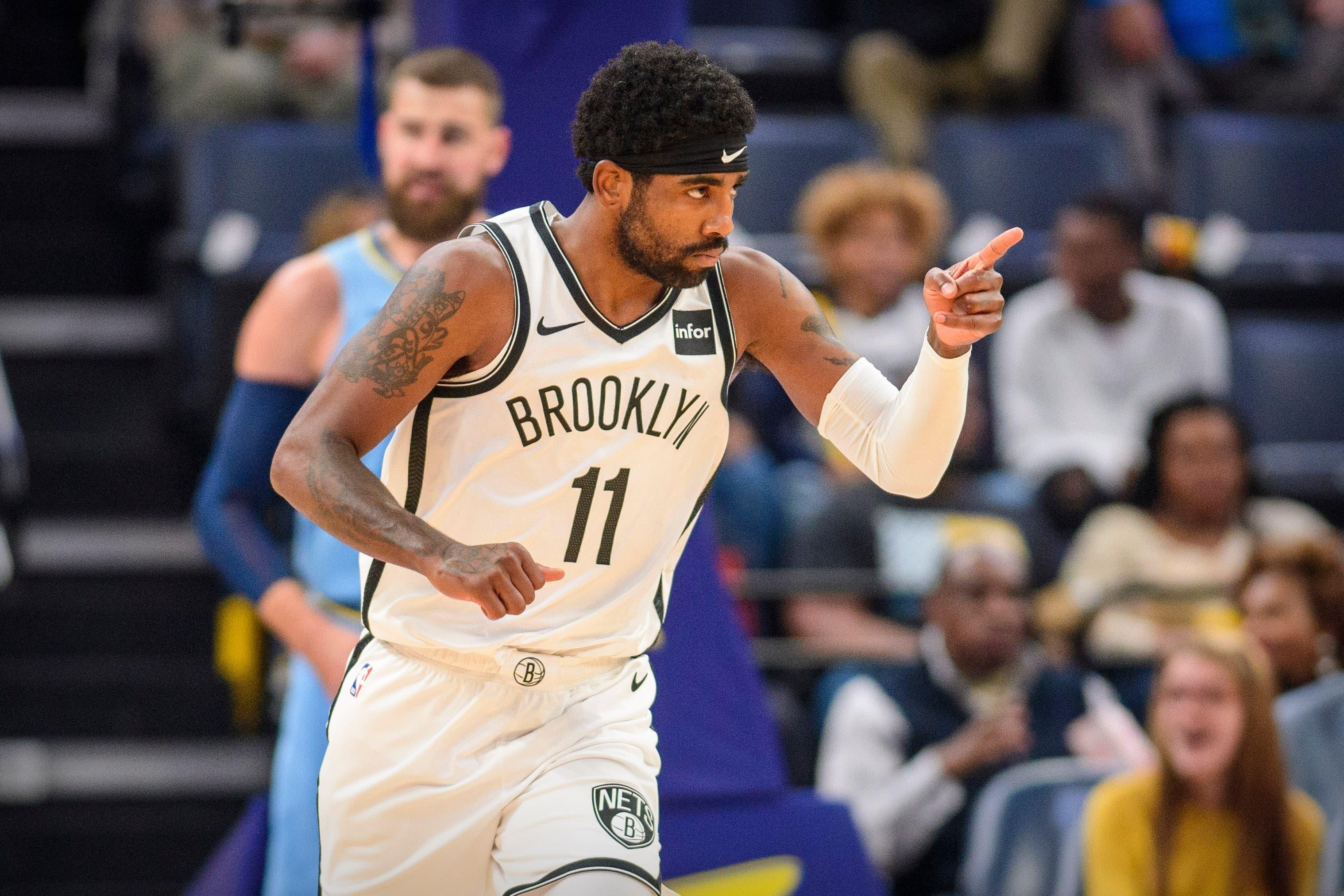 Oct 27, 2019; Memphis, TN, USA; Brooklyn Nets guard Kyrie Irving (11) celebrates making a shot against the Memphis Grizzlies during the first quarter at the FedExForum. Mandatory Credit: Jerome Miron-USA TODAY Sports / Jerome Miron