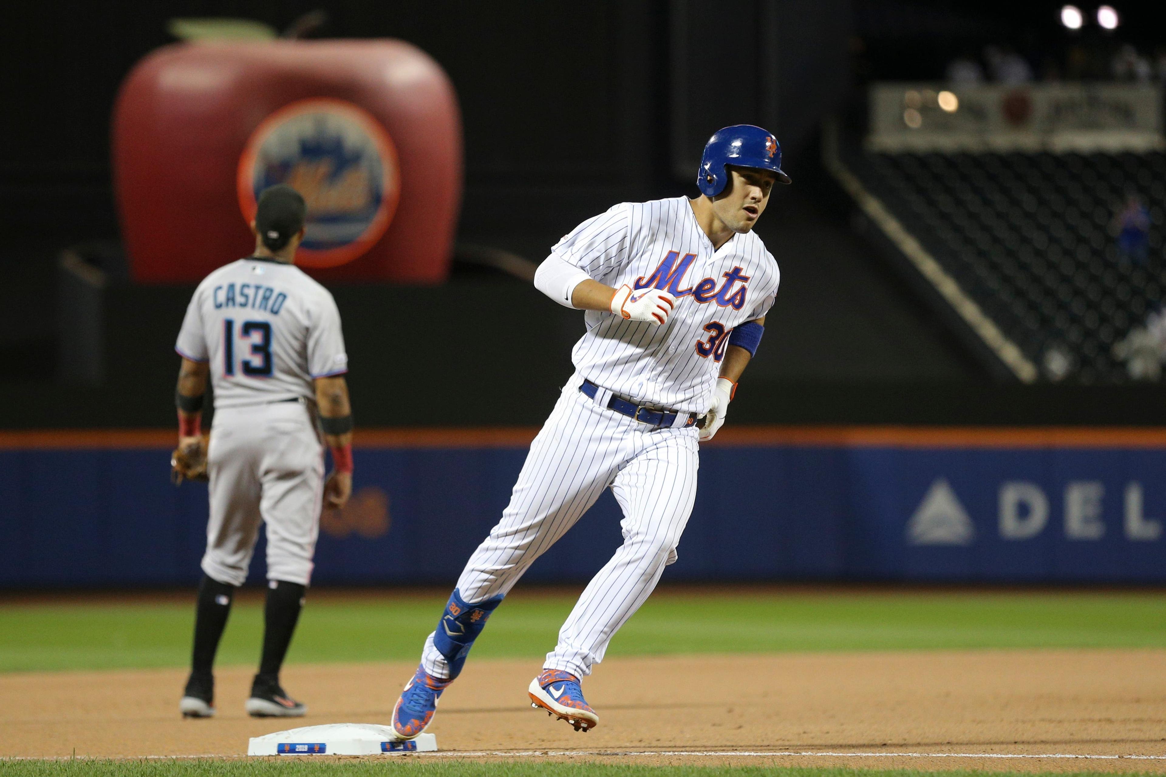 Sep 24, 2019; New York City, NY, USA; New York Mets right fielder Michael Conforto (30) rounds third base in front of Miami Marlins third baseman Starlin Castro (13) after hitting a two run home run against the Miami Marlins during the seventh inning at Citi Field. Mandatory Credit: Brad Penner-USA TODAY Sports / Brad Penner