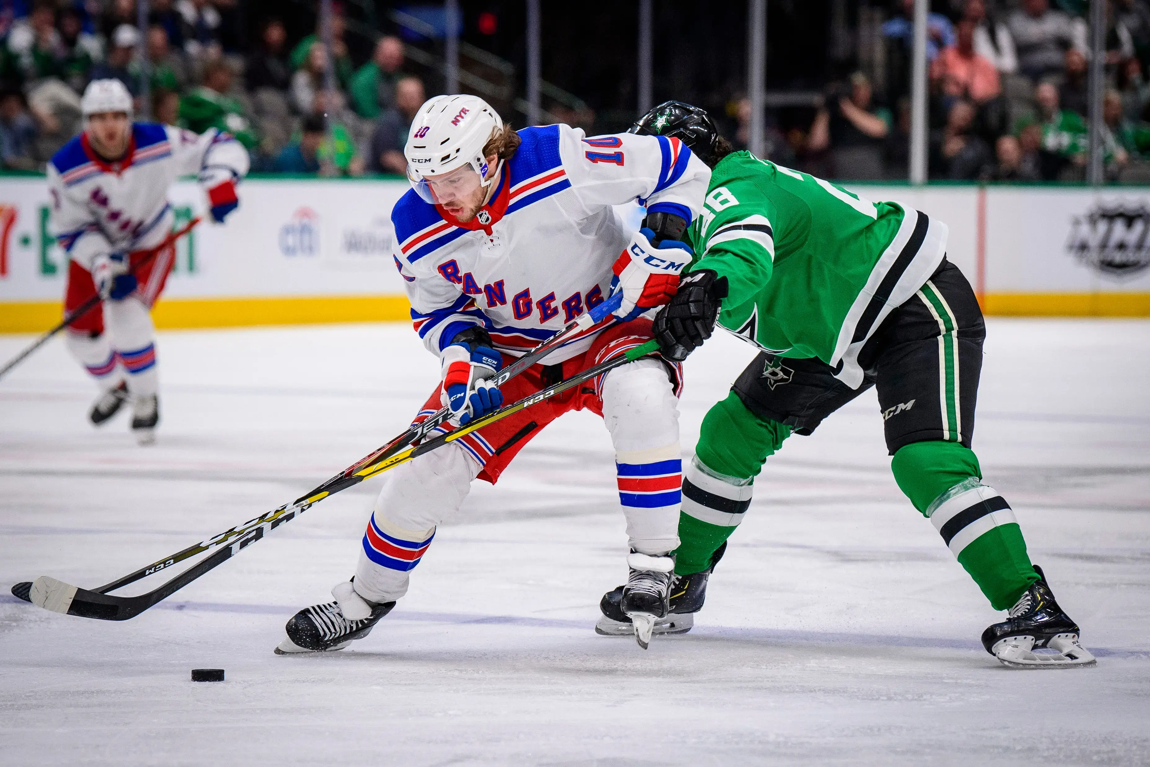 Mar 10, 2020; Dallas, Texas, USA; New York Rangers left wing Artemi Panarin (10) and Dallas Stars defenseman Stephen Johns (28) in action during the game between the Rangers and the Stars at the American Airlines Center. / © Jerome Miron-USA TODAY Sports