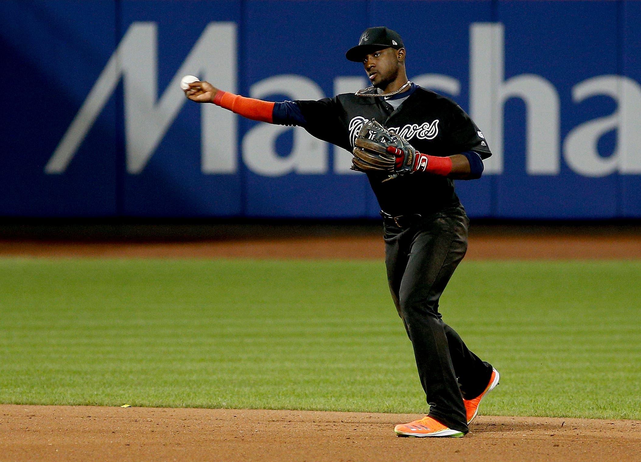 Aug 24, 2019; New York City, NY, USA; Atlanta Braves shortstop Adeiny Hechavarria (24) throws to first base against the New York Mets during the seventh inning of an MLB Players' Weekend game at Citi Field. Mandatory Credit: Andy Marlin-USA TODAY Sports / Andy Marlin