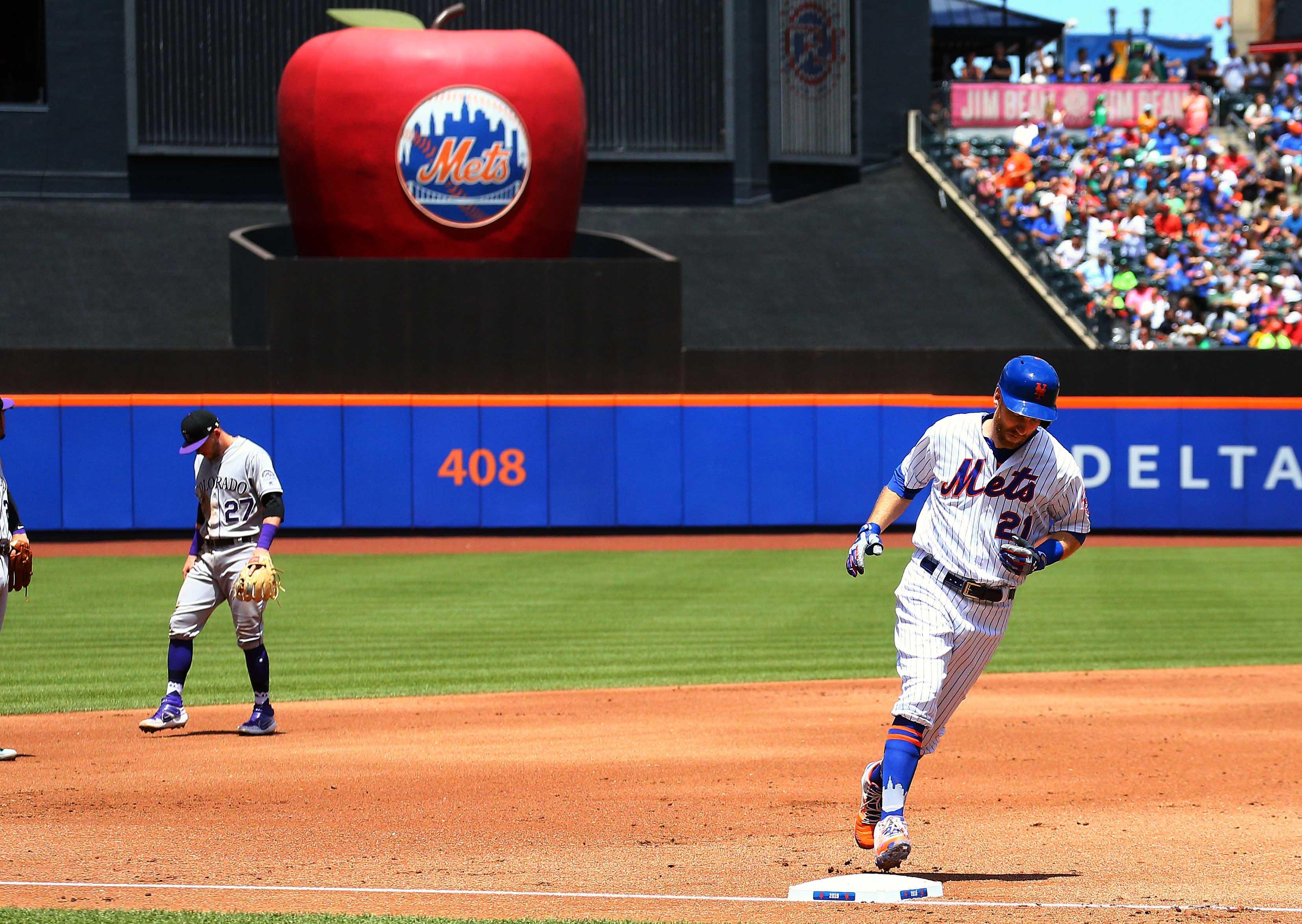 New York Mets third baseman Todd Frazier rounds the bases after hitting three-run home run against the Colorado Rockies during the first inning at Citi Field.