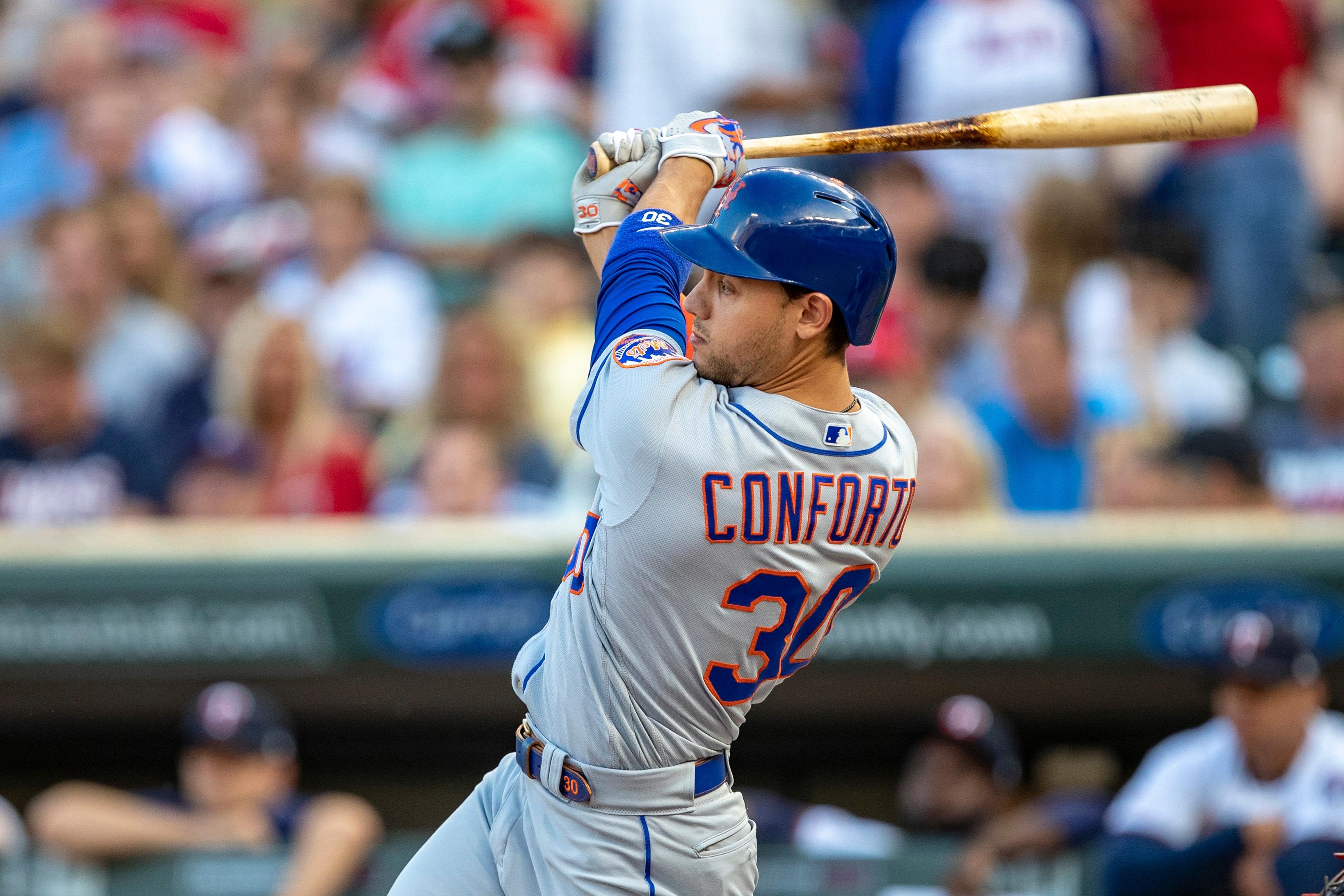 Jul 16, 2019; Minneapolis, MN, USA; New York Mets center fielder Michael Conforto (30) hits a single in the first inning against the Minnesota Twins at Target Field. Mandatory Credit: Jesse Johnson-USA TODAY Sports