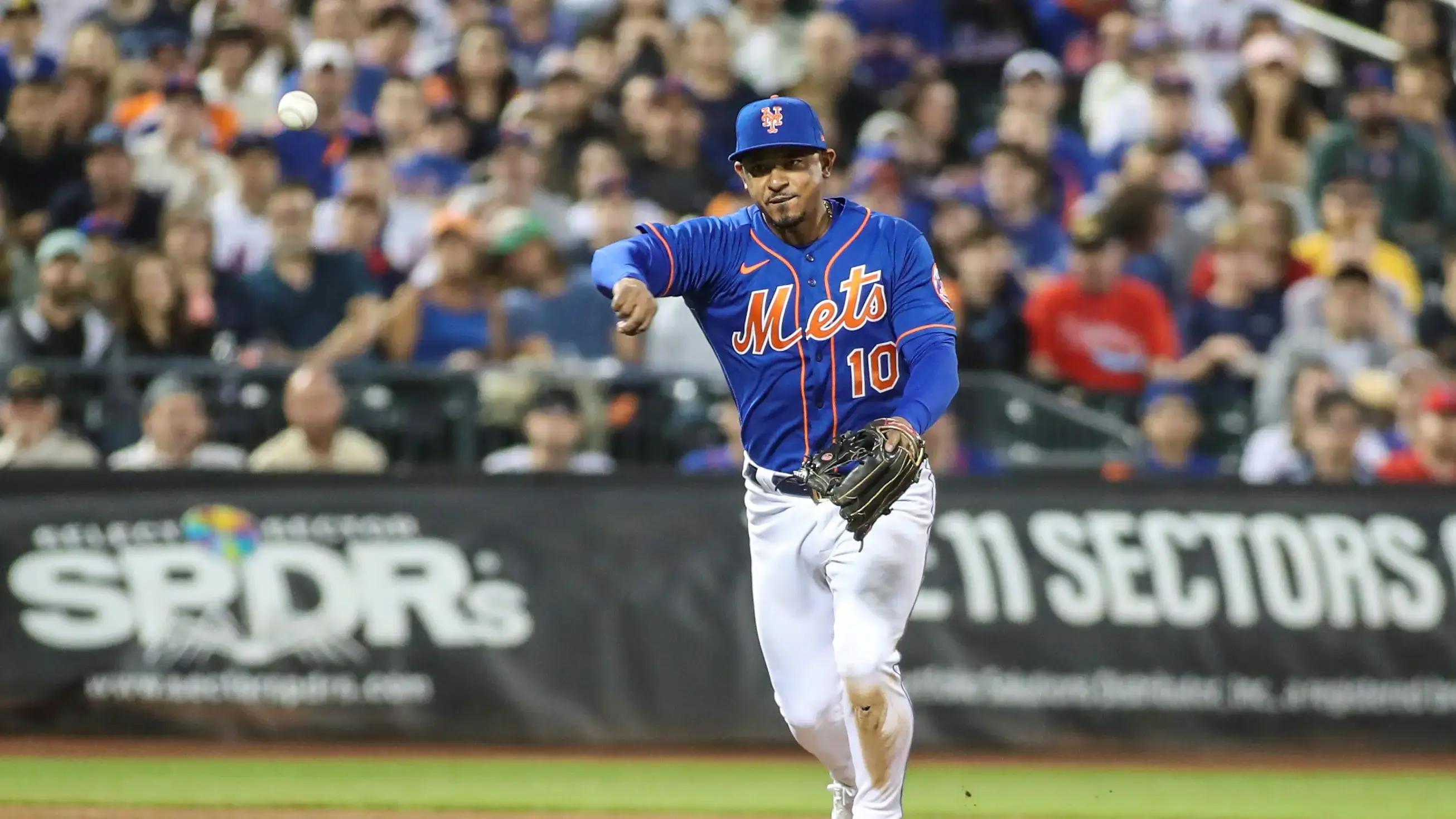 May 29, 2022; New York City, New York, USA; New York Mets third baseman Eduardo Escobar (10) makes a running throw for an assist in the fourth inning against the Philadelphia Phillies at Citi Field. / Wendell Cruz-USA TODAY Sports